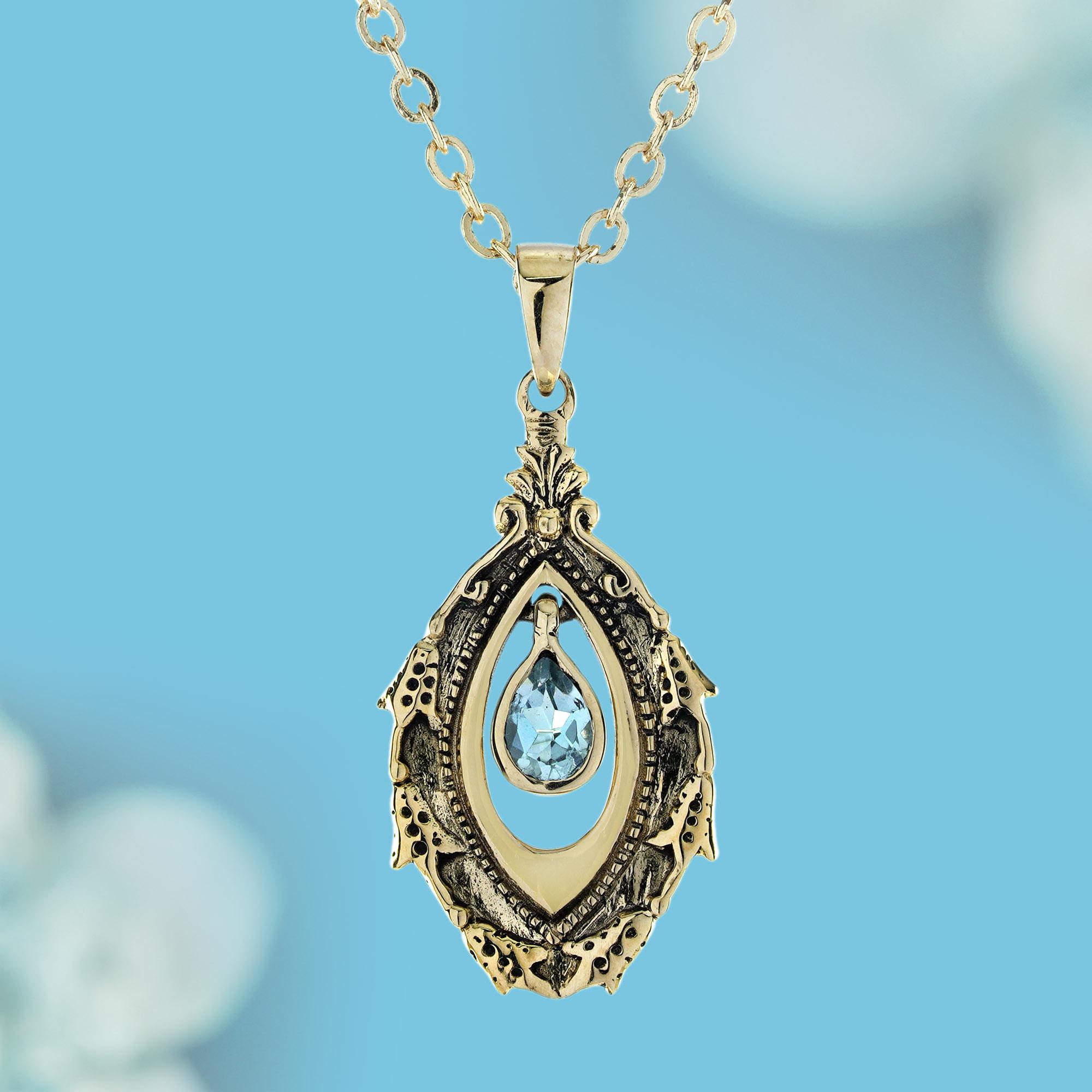 Wrap yourself in the comforting embrace of timeless beauty with our Natural Blue Topaz Vintage Victorian-Style Drop Pendant in Solid 9K Yellow Gold. 
This captivating pendant features a dazzling natural blue topaz, radiating a serene and tranquil