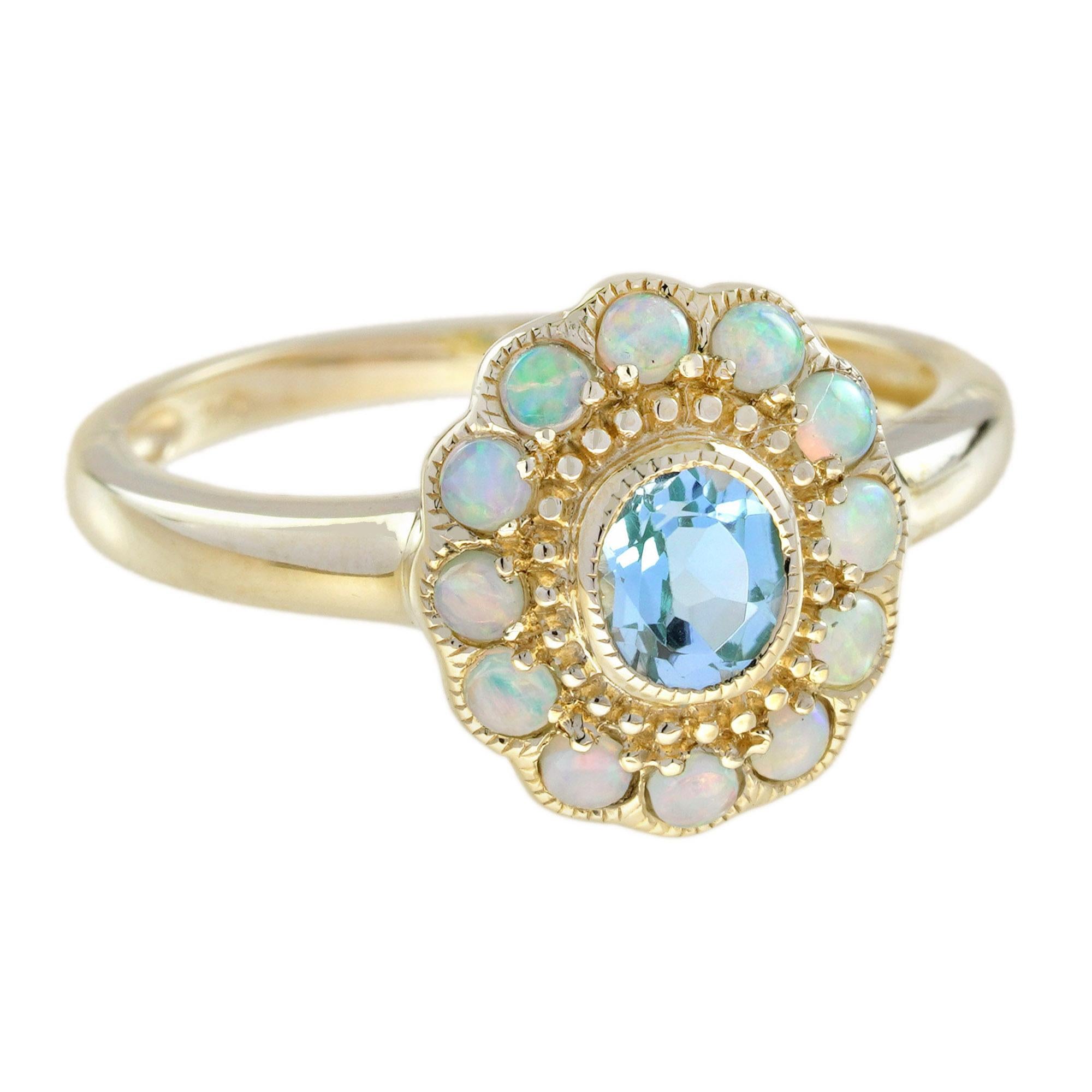 Ein Kleiderring im Vintage-Stil mit einem ovalen himmelblauen Topas von ca. 0,42 Karat in der Mitte, akzentuiert mit einem zeitlosen Heiligenschein aus zwölf weißen Opalblättern. Dieser hübsche Ring ist aus Gelbgold gefertigt und verfügt über eine