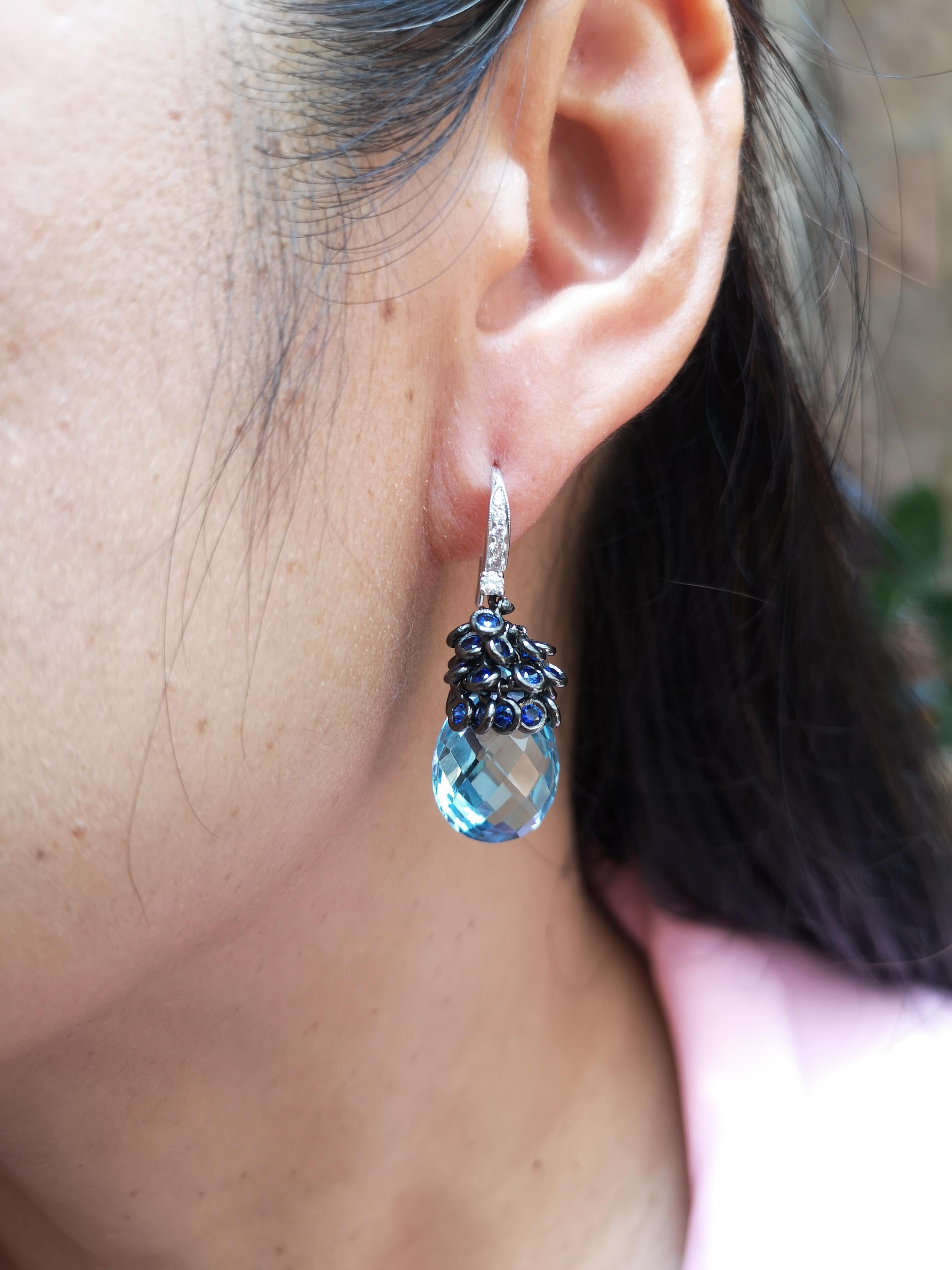Blue Topaz 19.01 carats with Blue Sapphire 2.20 carats and Diamond 0.21 carat Earrings set in 18 Karat White Gold Settings

Width:  1.5 cm 
Length: 3.5 cm
Total Weight: 14.22 grams

