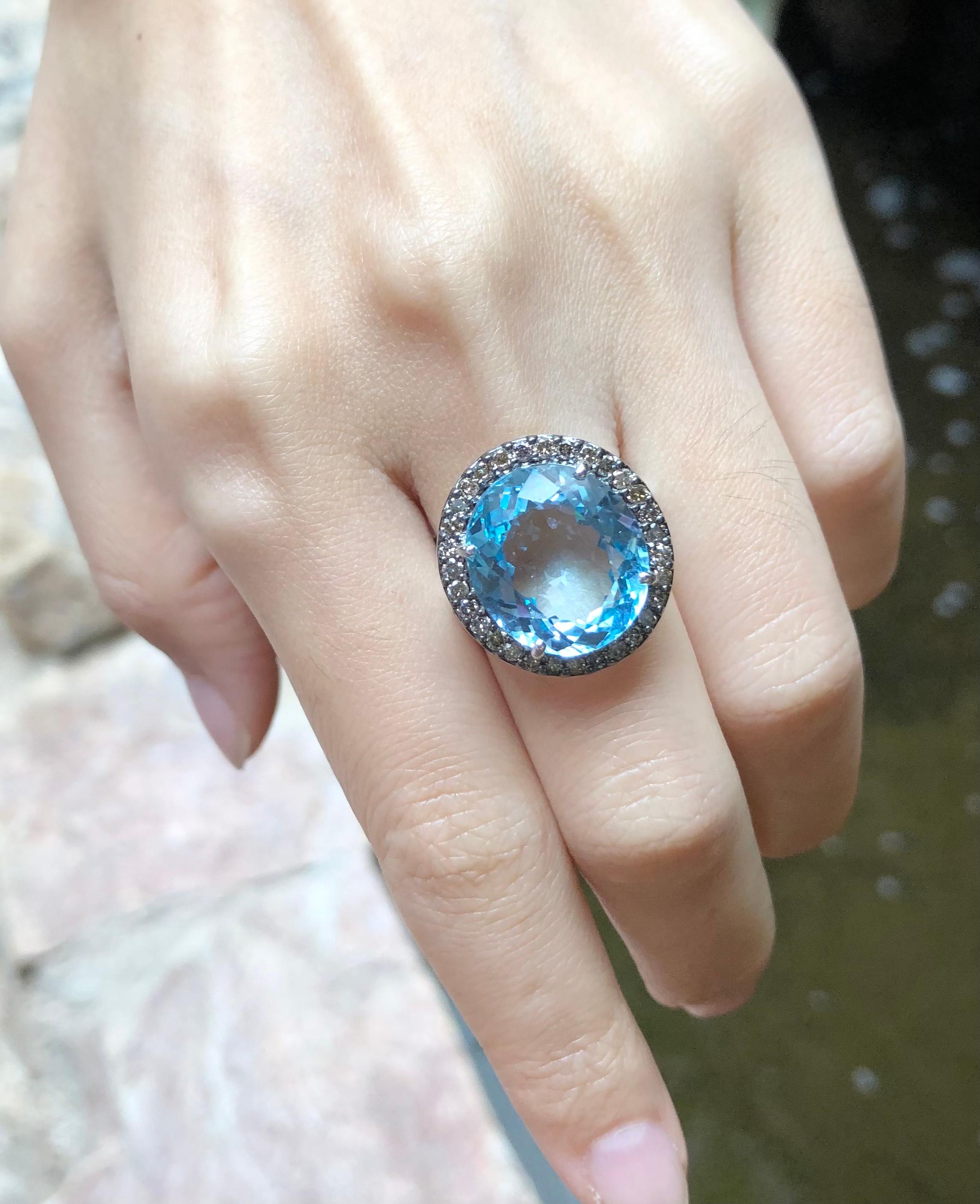 Oval Cut Blue Topaz with Brown Diamond Ring Set in 18 Karat White Gold Settings For Sale