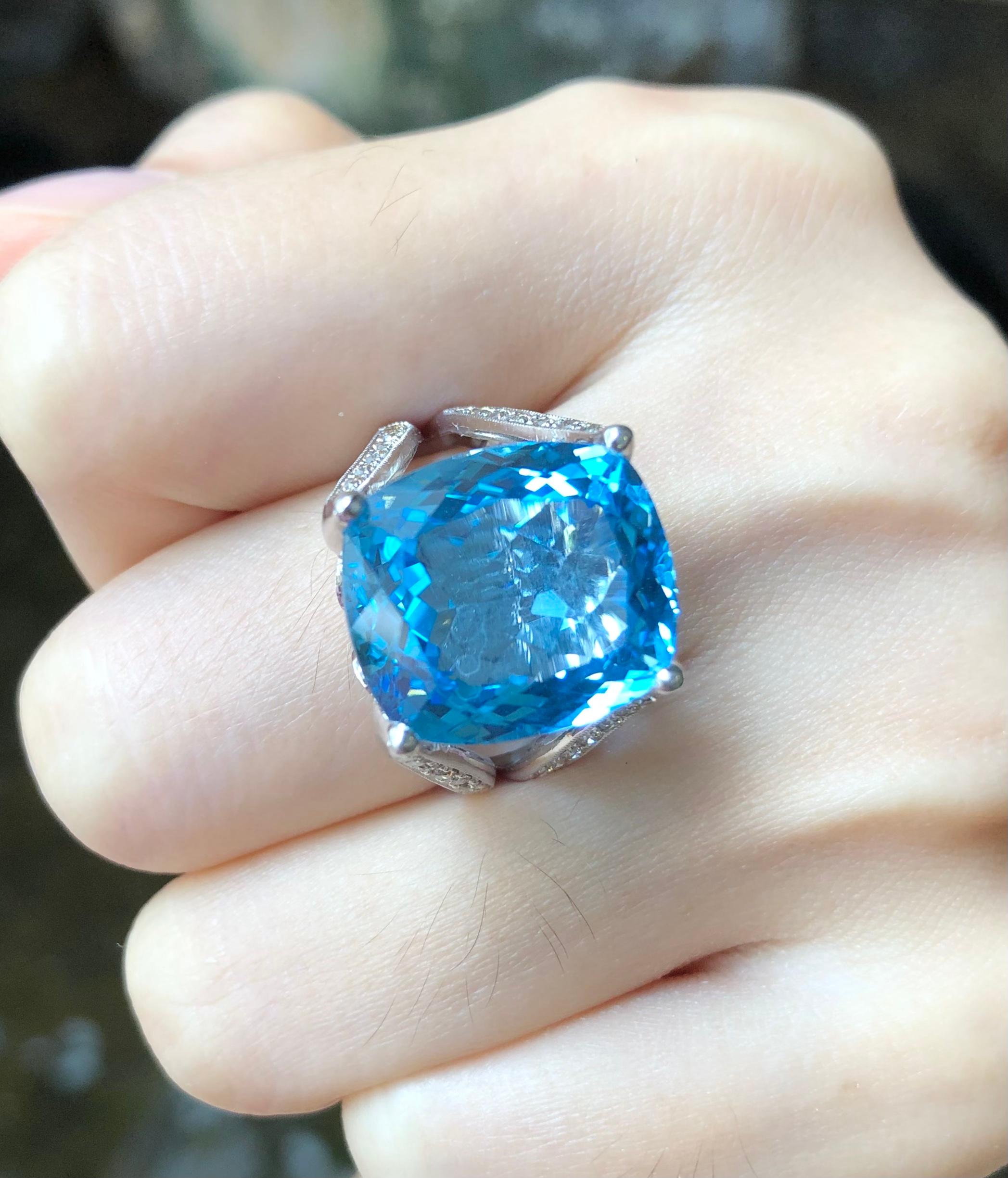 Contemporary Blue Topaz with Brown Diamond Ring Set in 18 Karat White Gold Settings For Sale