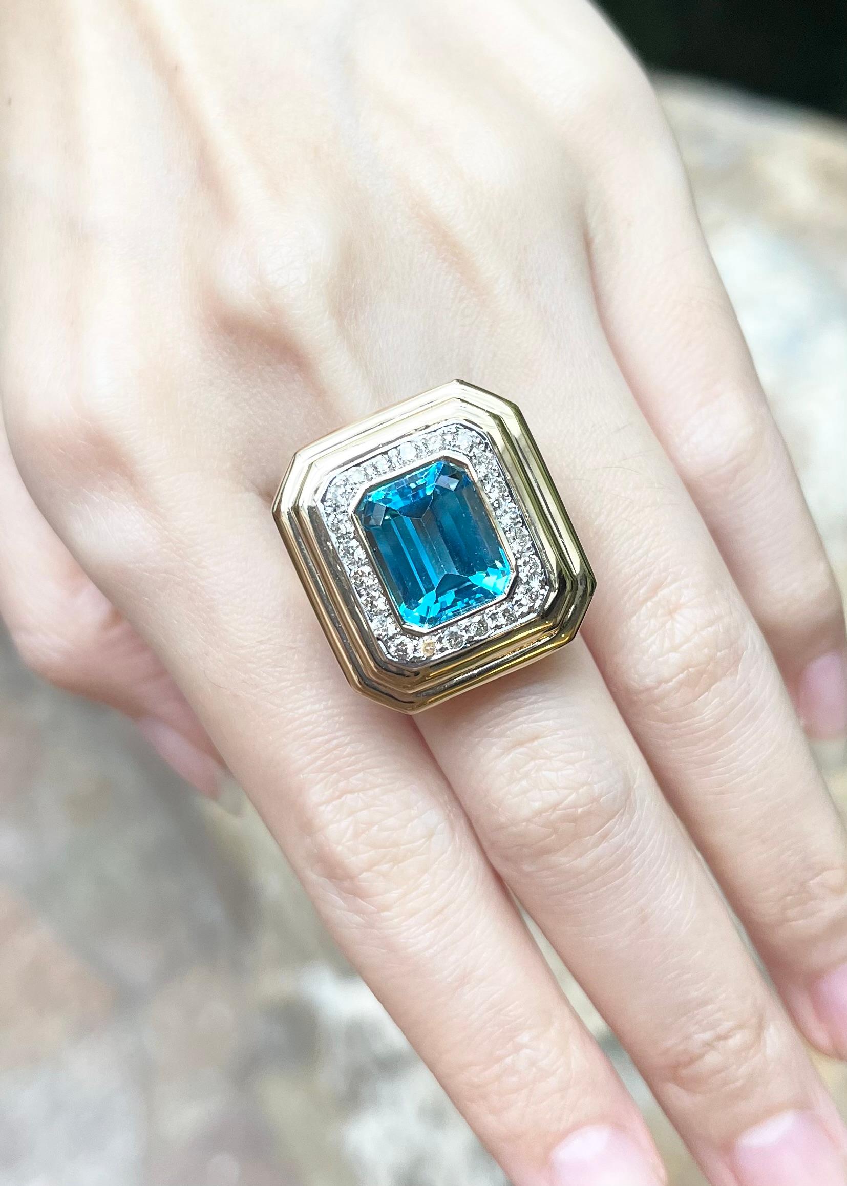 Emerald Cut Blue Topaz with Diamond 0.64 Ring set in 14K Gold Settings For Sale