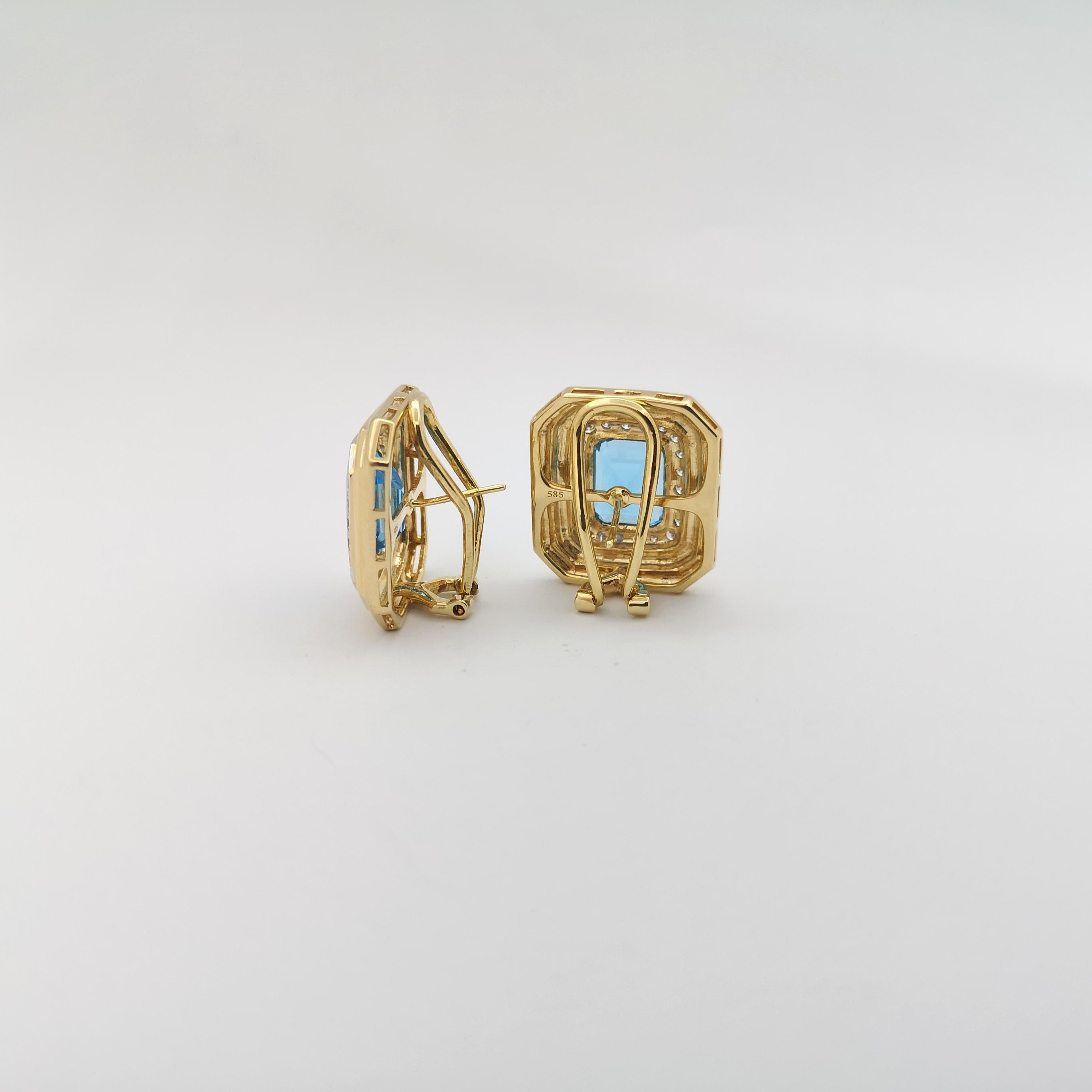 Emerald Cut Blue Topaz with Diamond Earrings set in 14K Gold Settings For Sale