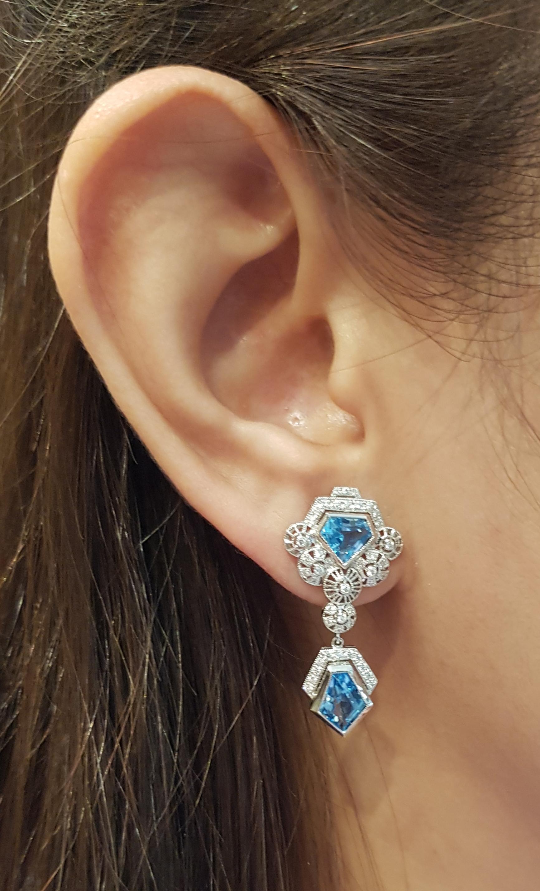 Blue Topaz 4.0 carats with Diamond 0.32 carat Earrings set in 18 Karat White Gold Settings

Width:  1.6 cm 
Length: 3.3 cm
Total Weight: 8.31 grams

