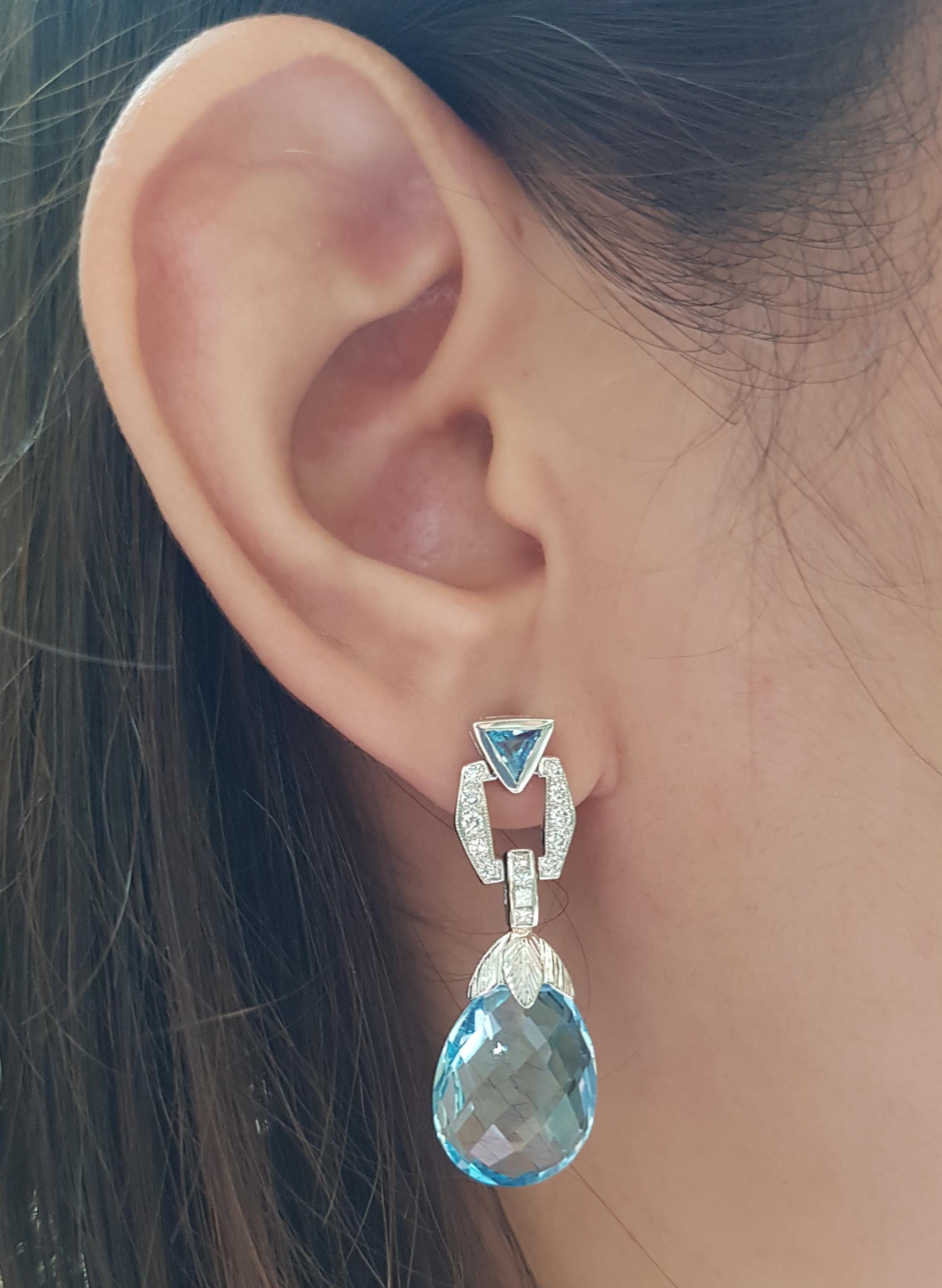 Blue Topaz 29.0 carats with Diamond 0.50 carat Earrings set in 18 Karat White Gold Settings

Width:  1.3 cm 
Length: 3.8 cm
Total Weight: 11.67 grams

