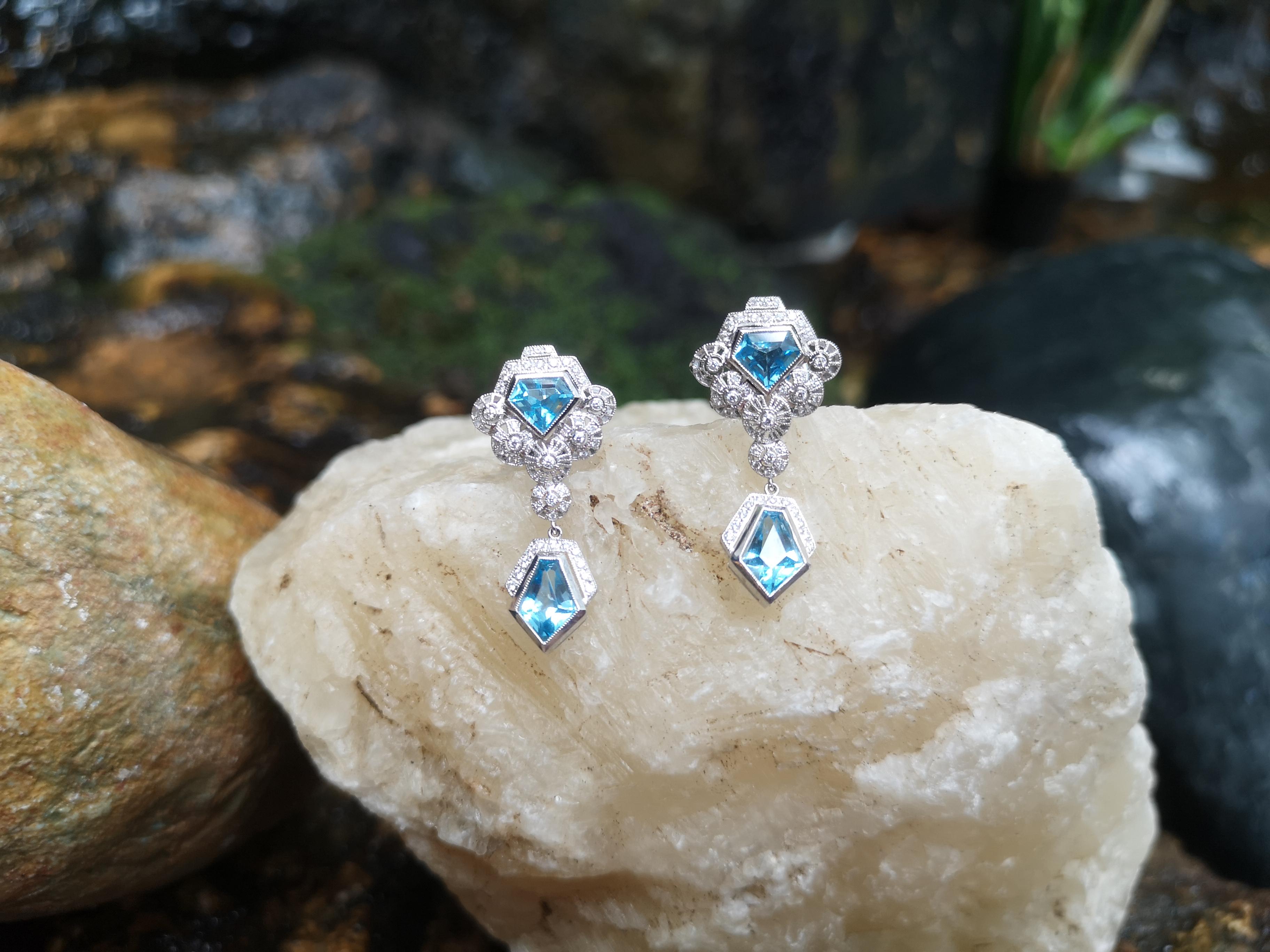 Women's Blue Topaz with Diamond Earrings Set in 18 Karat White Gold Settings For Sale