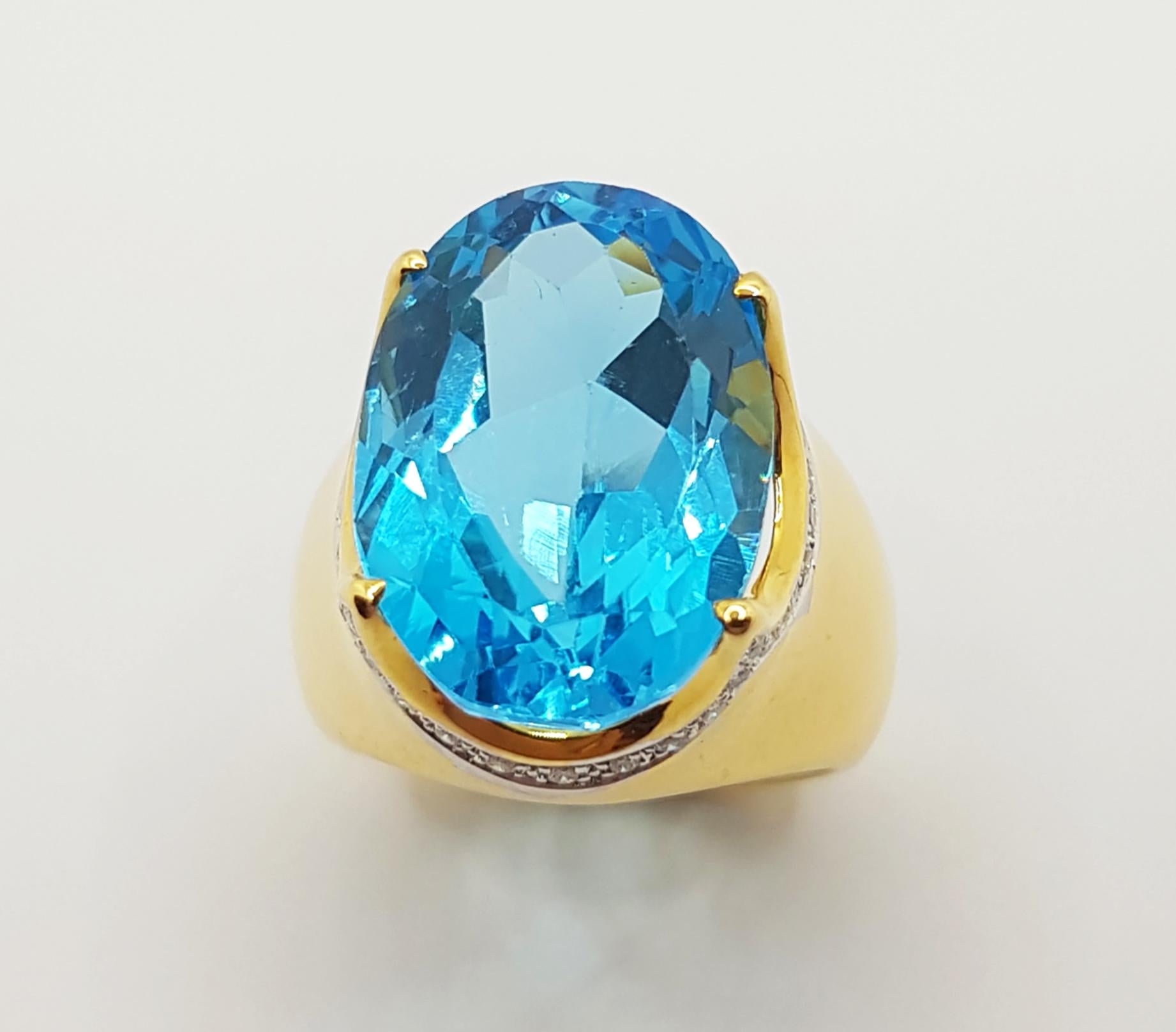 Bague en or 18 carats sertie d'une topaze bleue et de diamants en vente 4
