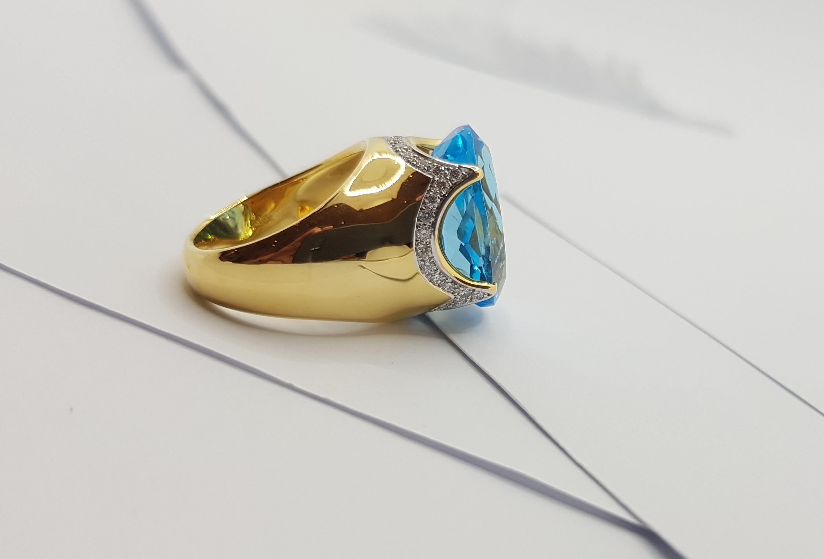 Bague en or 18 carats sertie d'une topaze bleue et de diamants en vente 5