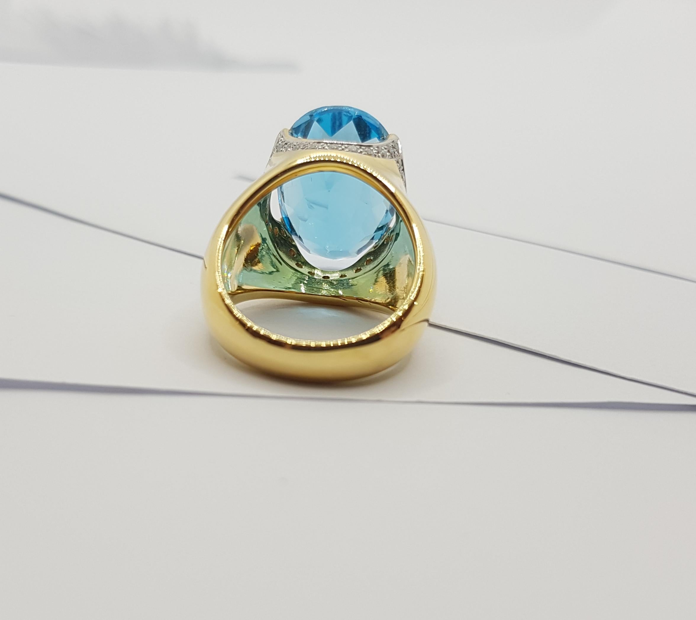 Bague en or 18 carats sertie d'une topaze bleue et de diamants en vente 7