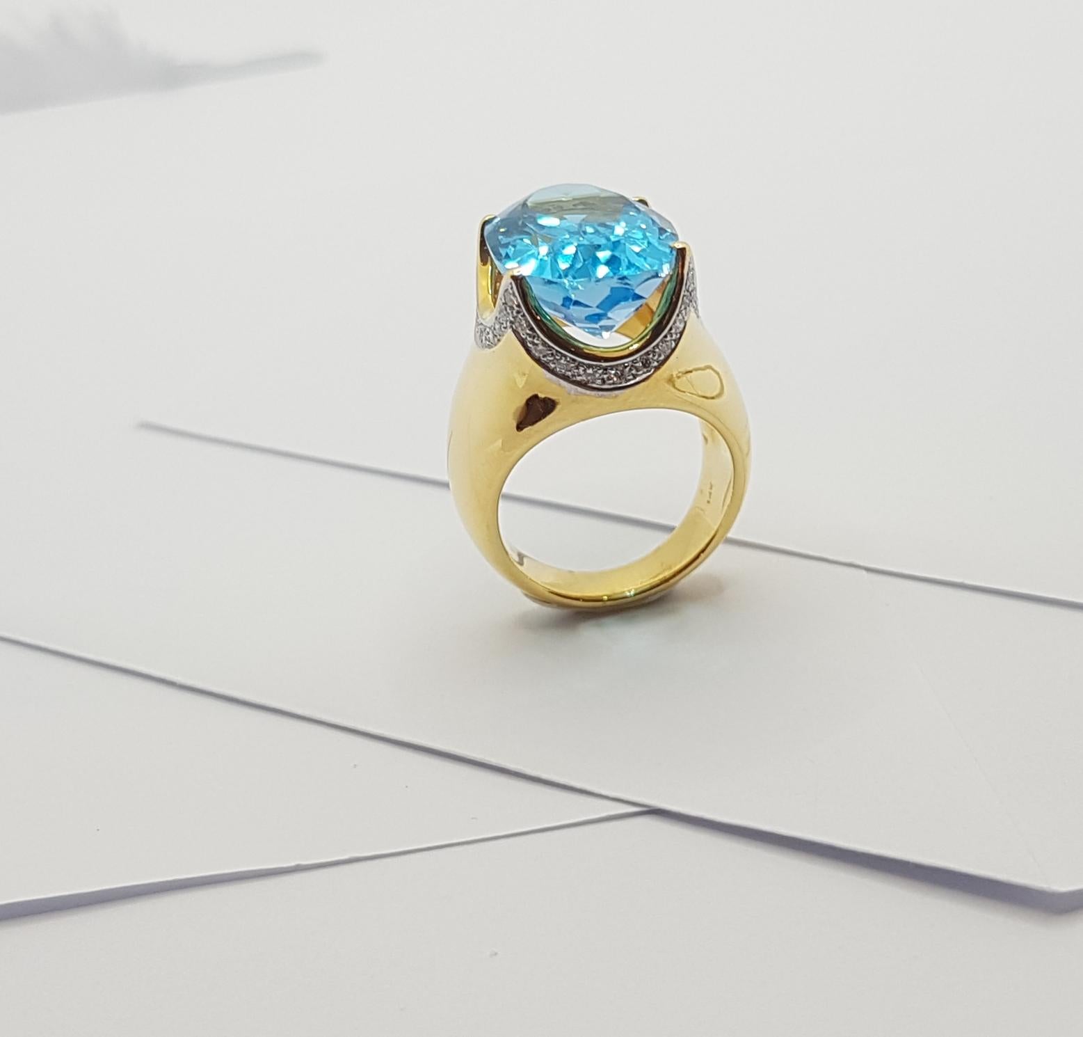 Bague en or 18 carats sertie d'une topaze bleue et de diamants en vente 10