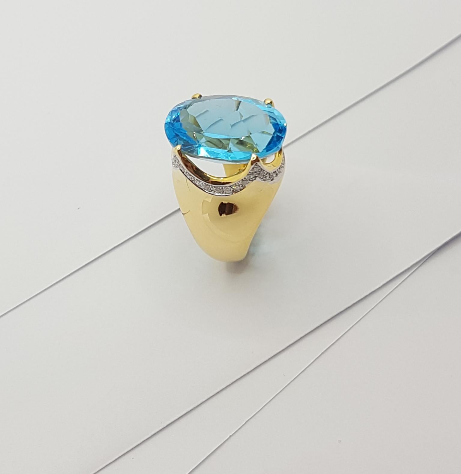 Bague en or 18 carats sertie d'une topaze bleue et de diamants en vente 11