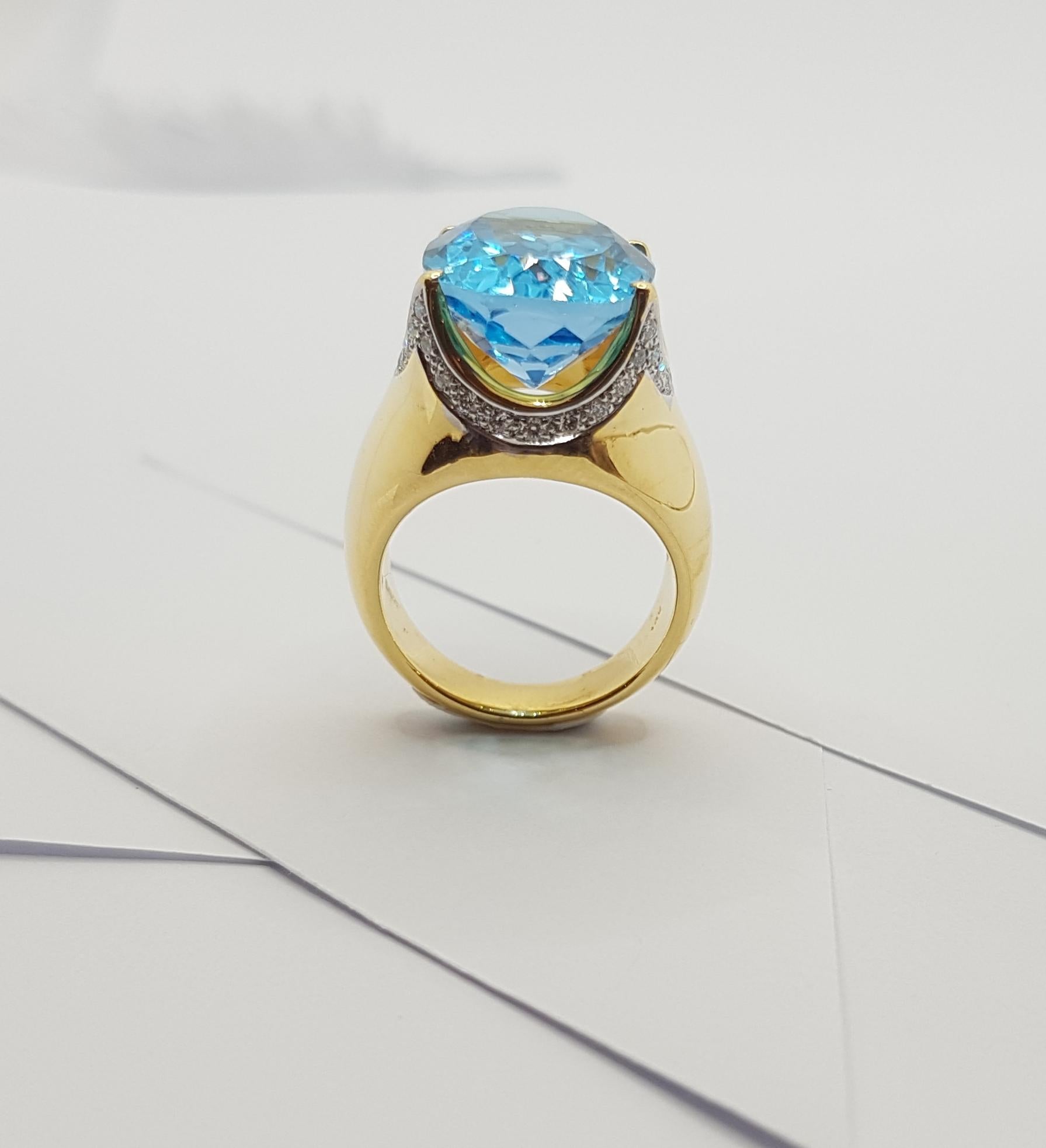Bague en or 18 carats sertie d'une topaze bleue et de diamants en vente 12