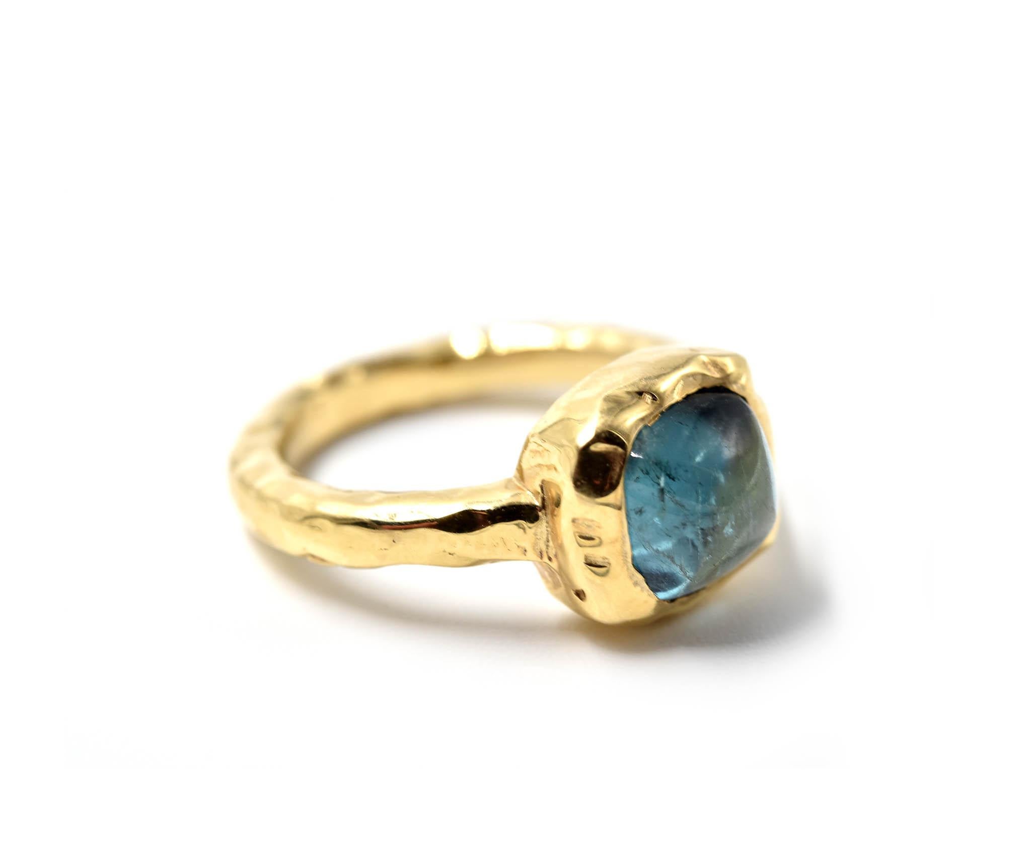 Designer: custom design
Material: 14k yellow gold
Blue Tourmaline: one cabochon cut 7.7mm blue tourmaline
Ring Size: 5 1/2 (please allow two additional shipping days for sizing requests)
Weight: 6.3 grams
