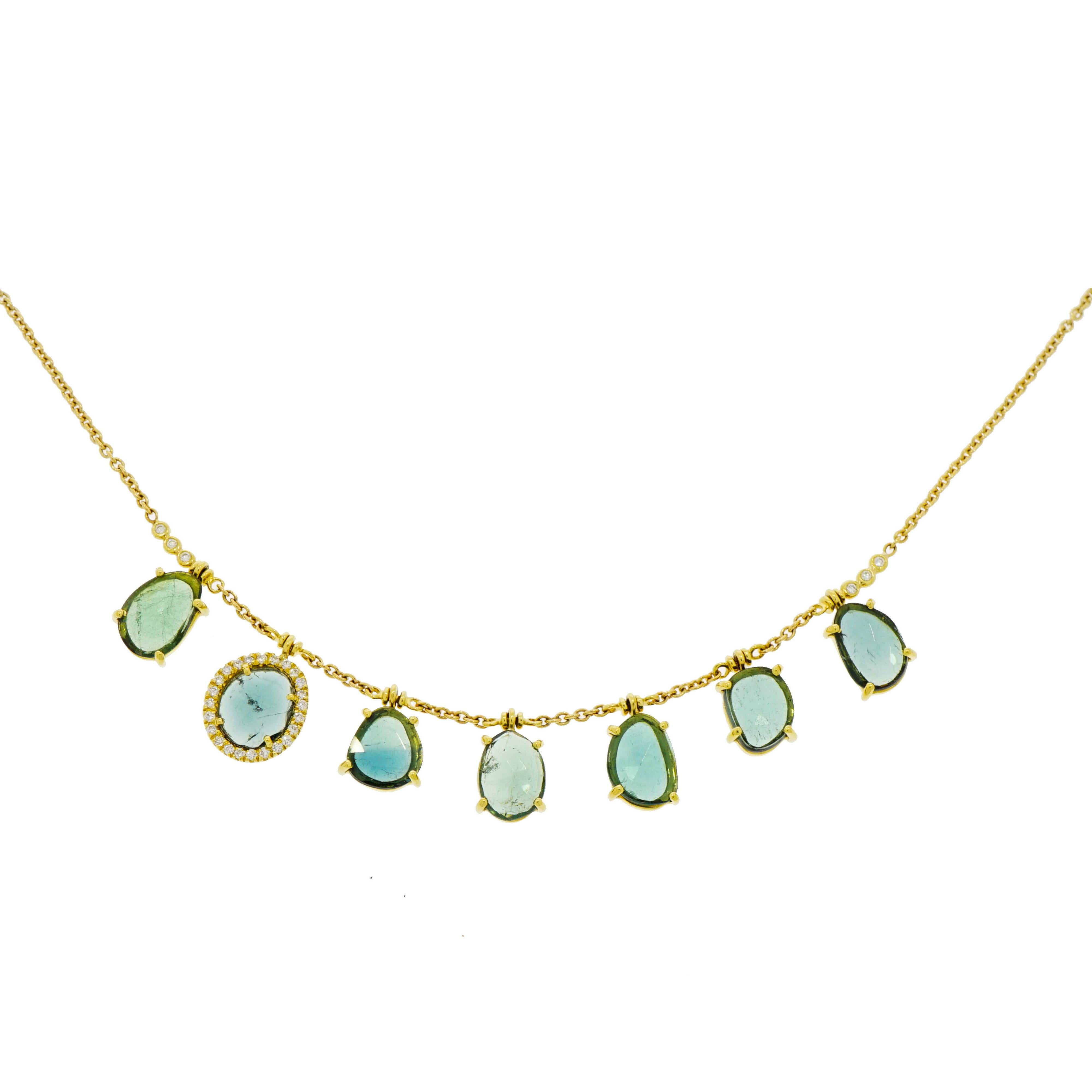 The garden party motif isn't going anywhere... In line with the pastel and floral jewelry trends, light and airy color schemes with plenty of diamonds are sure to please everyone. Just like this unique Blue Tourmaline drops Necklace designed and