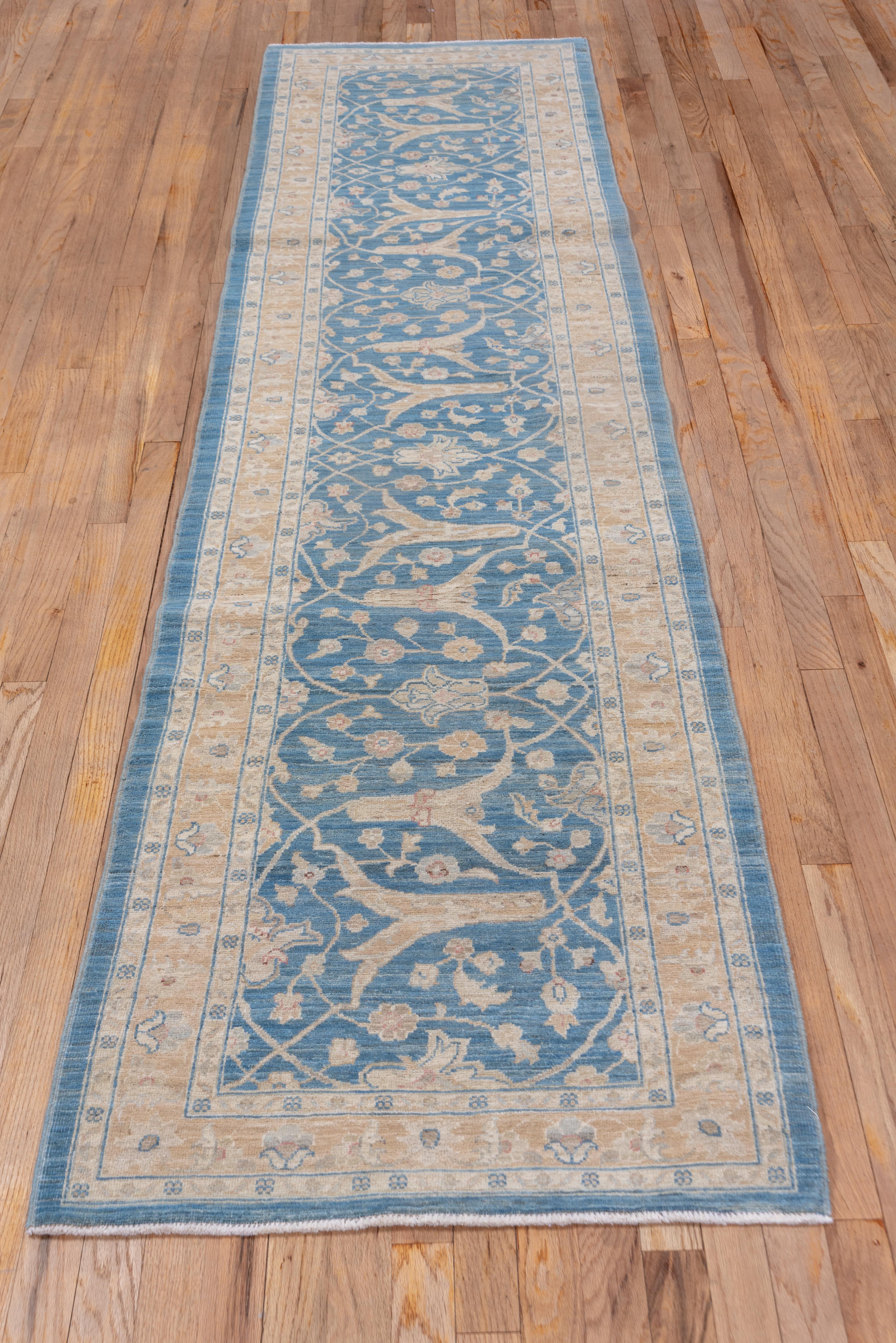 The light blue field has requisitioned a border with small escutcheon palmettes and larger forked arabesques and created a visually attractive runner. The yellow straw border features simple palmettes. The use of a border section for a runner is