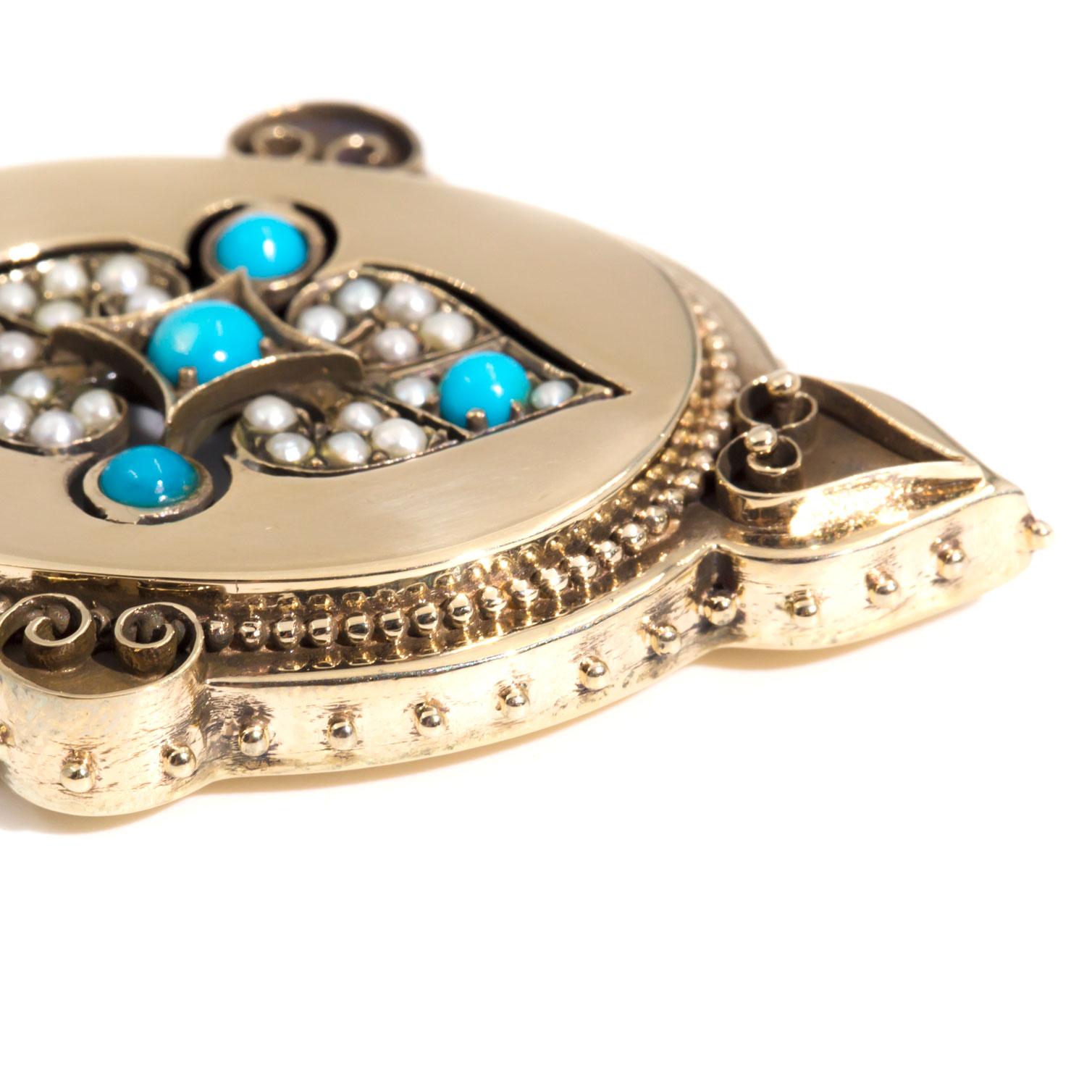 Carefully crafted in 9 carat yellow gold is this gorgeous vintage pendant featuring five round cabochon turquoise gems, further embellished with seed pearls, all carefully placed in an intricate pattern. She has a beautifully beaded border with