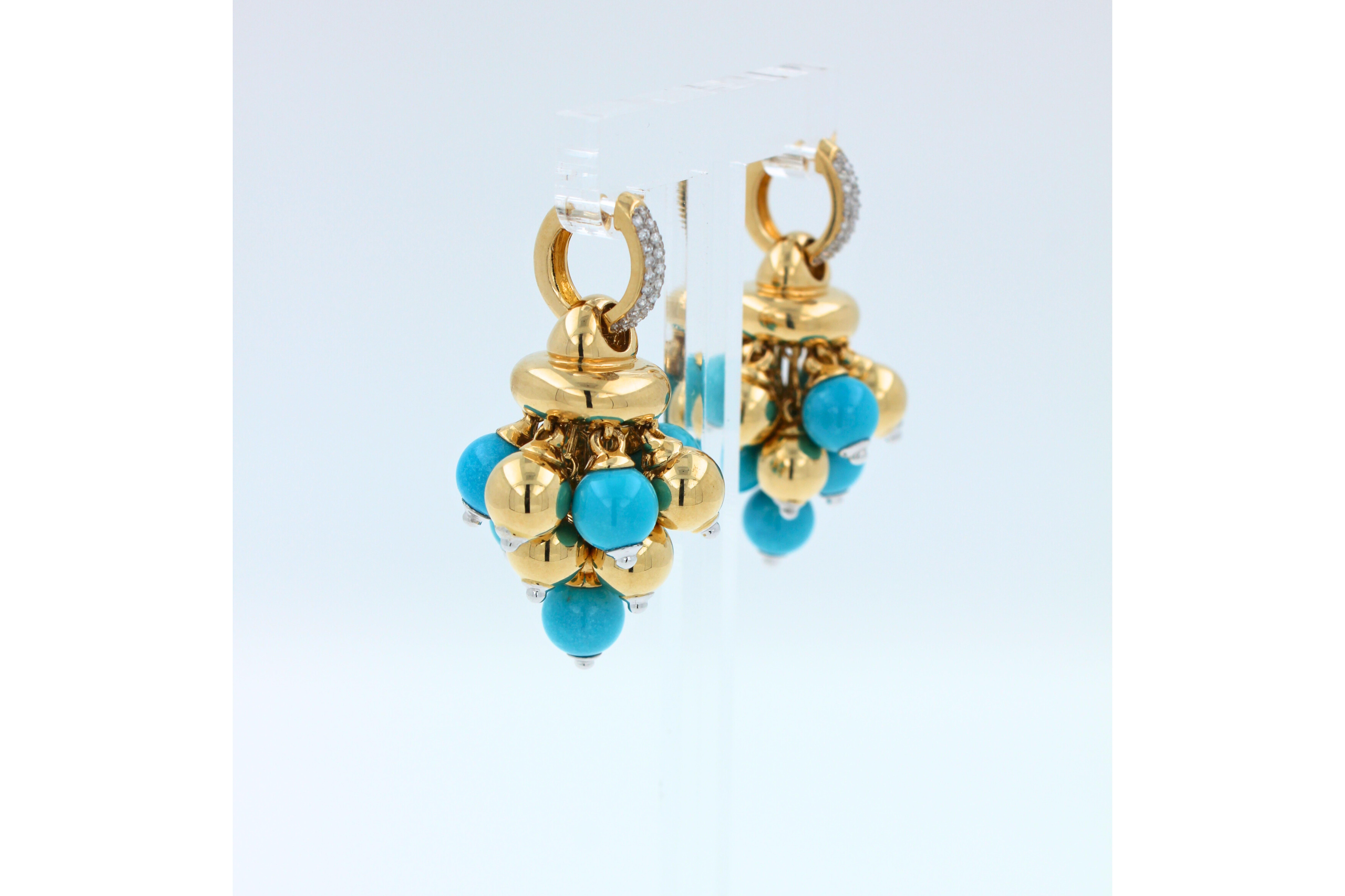 Very Beautiful, Unique, High-End Craftmanship with a polished finish. A versatile high-luxury fine set of earrings that can be worn with any outfit.
18K Yellow Gold & 18K White Gold Details 
Turquoise Gemstone Spheres
40.50 grams
0.20 carats