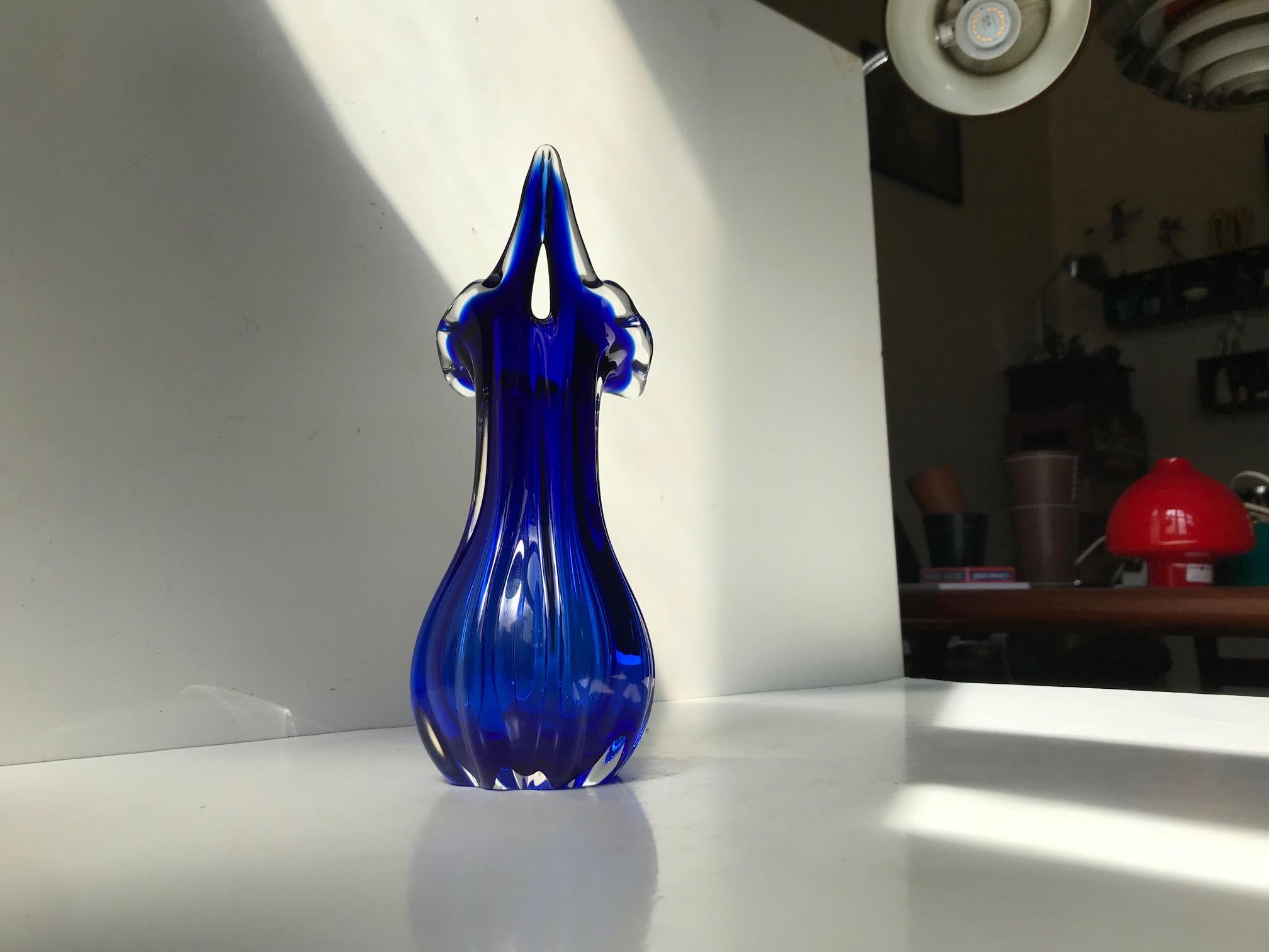 Biomorphically shaped vase in cased blue and clear hand blown glass. Designed and manufactured at Seguso in Murano Italy during the 1950s or 60s. This vase came with a sticker originally and does not have any markings to the base.