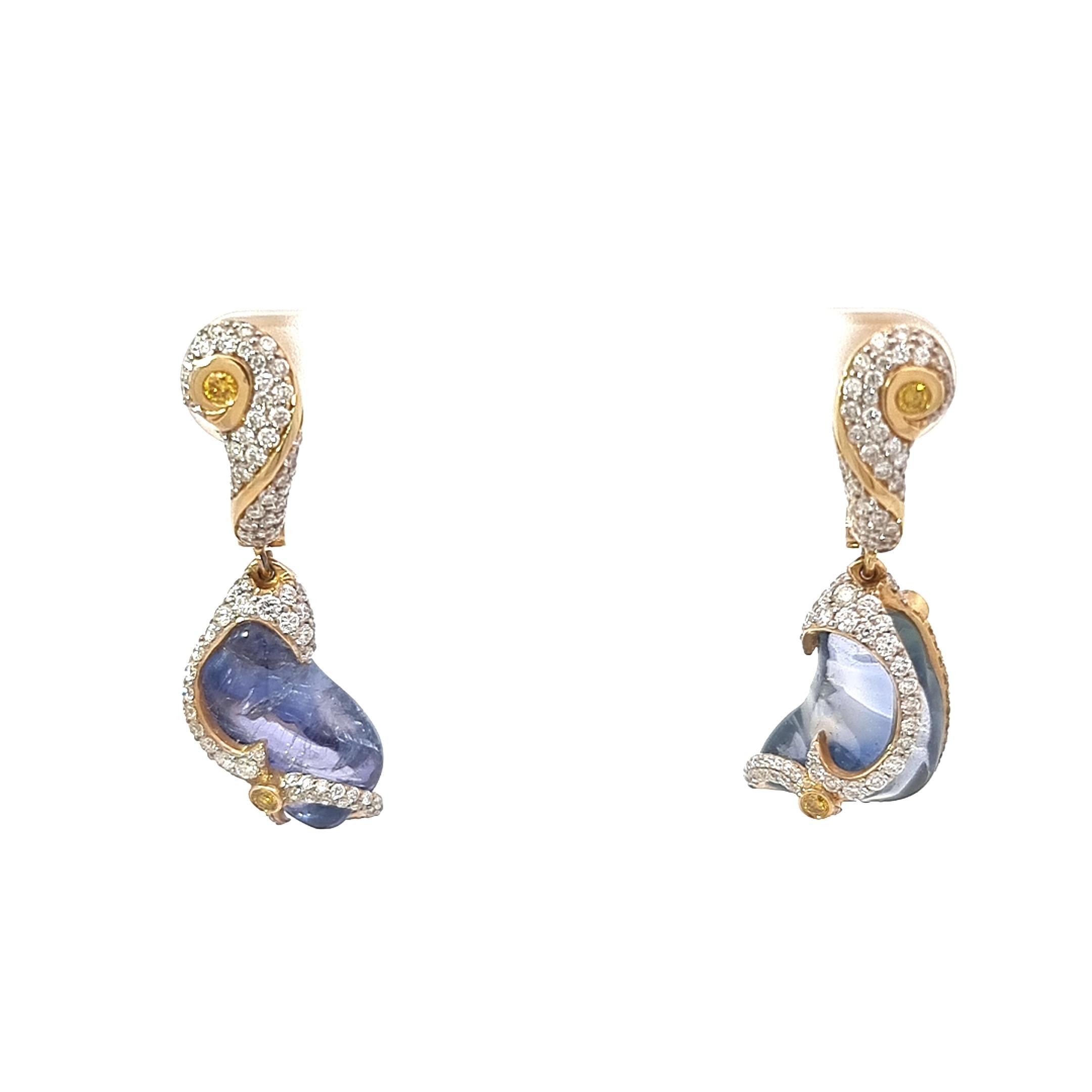 Organic Collection by VOTIVE.

Imagine adorning yourself with a pair of exquisite 18K gold dangling earrings that are truly one-of-a-kind. These earrings are a fusion of artistry and nature's whimsy, an enchanting celebration of the organic