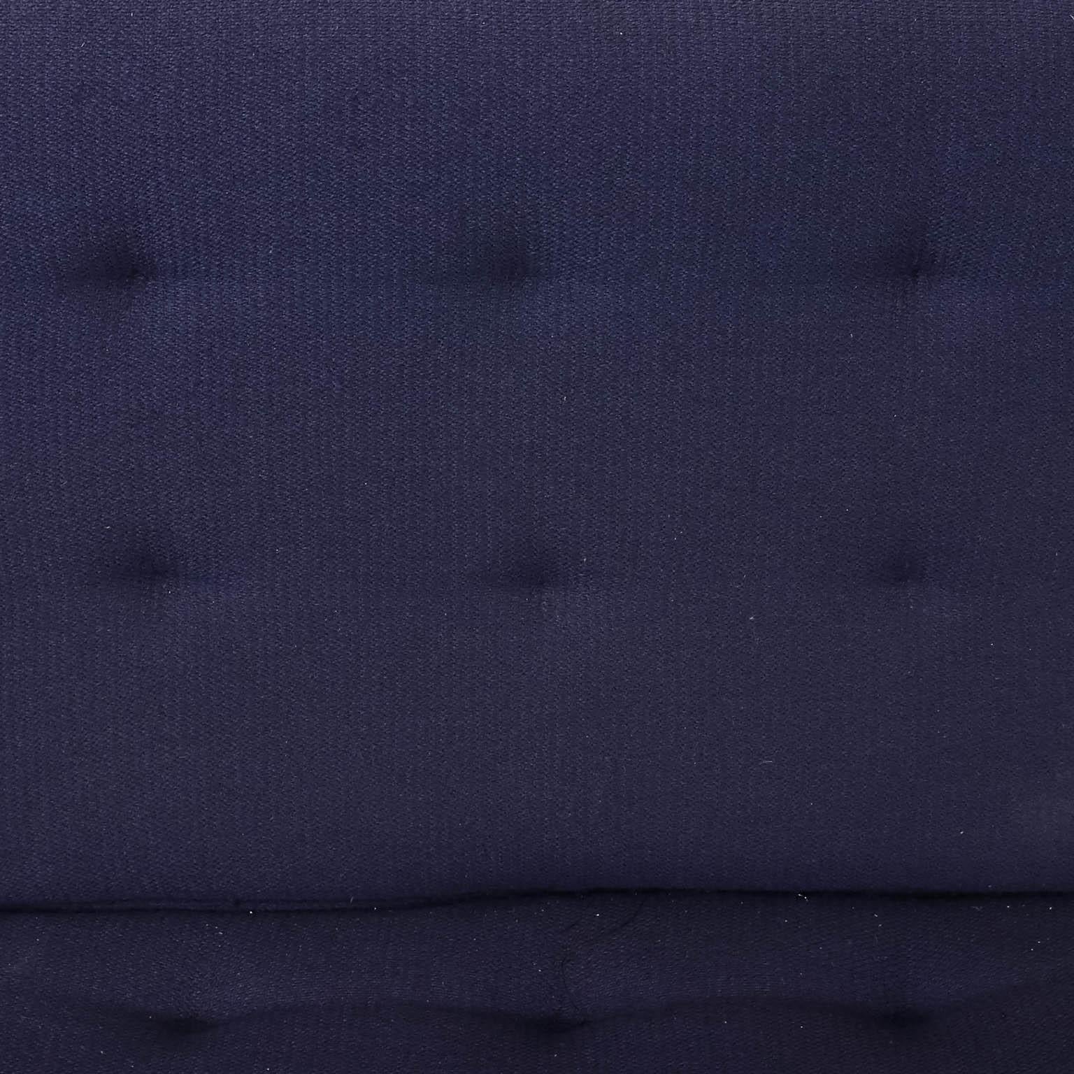 Mid-Century Modern style sofa upholstered in blue by Florence Knoll. The piece also features tufted seating. Please note of wear consistent with age as seen on the upholstery.