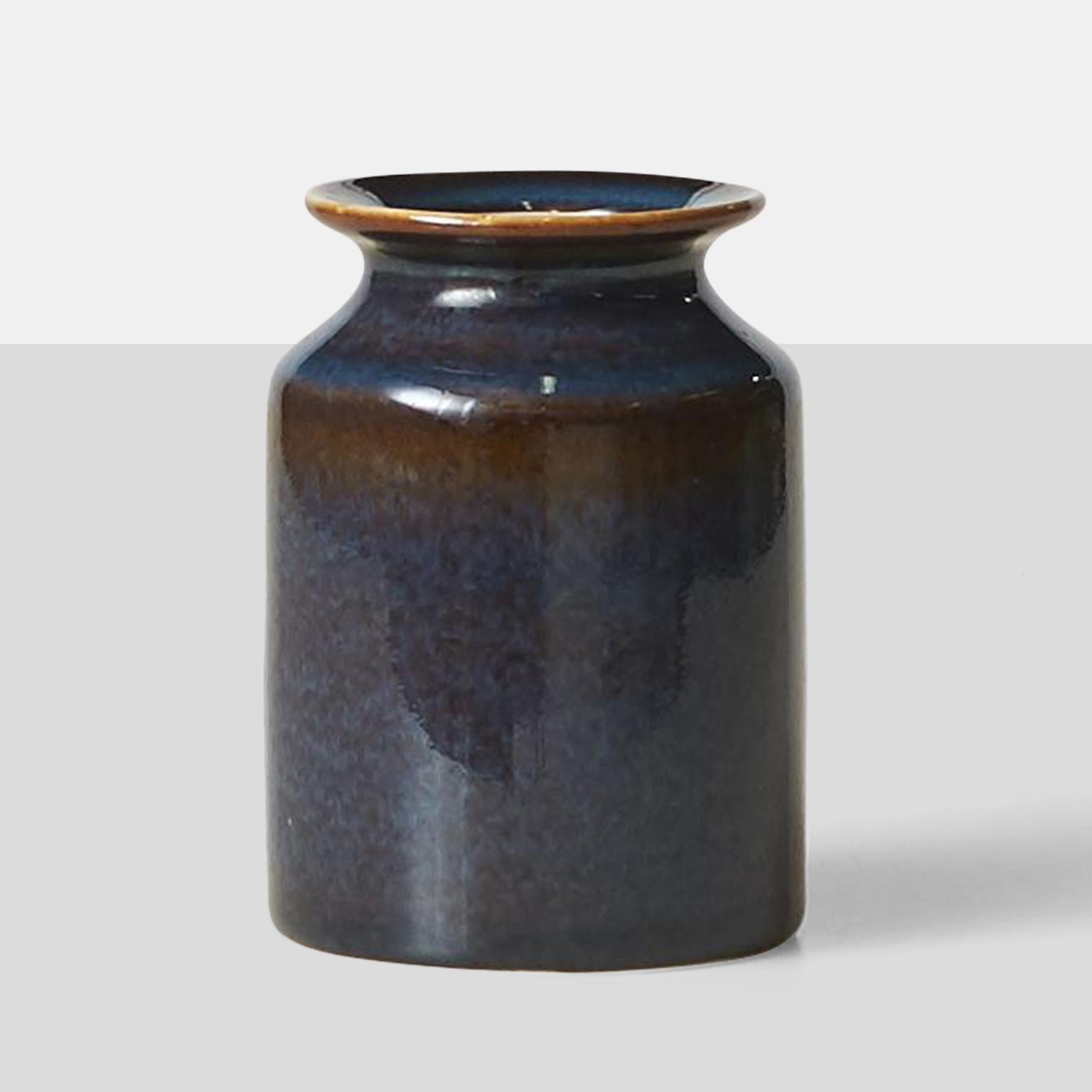 A stoneware vase by Carl Harry Stalhane, glazed in tones of cinnamon, purple, and blue. Signed for Rörstrand with the studio mark and the initials of the designer..