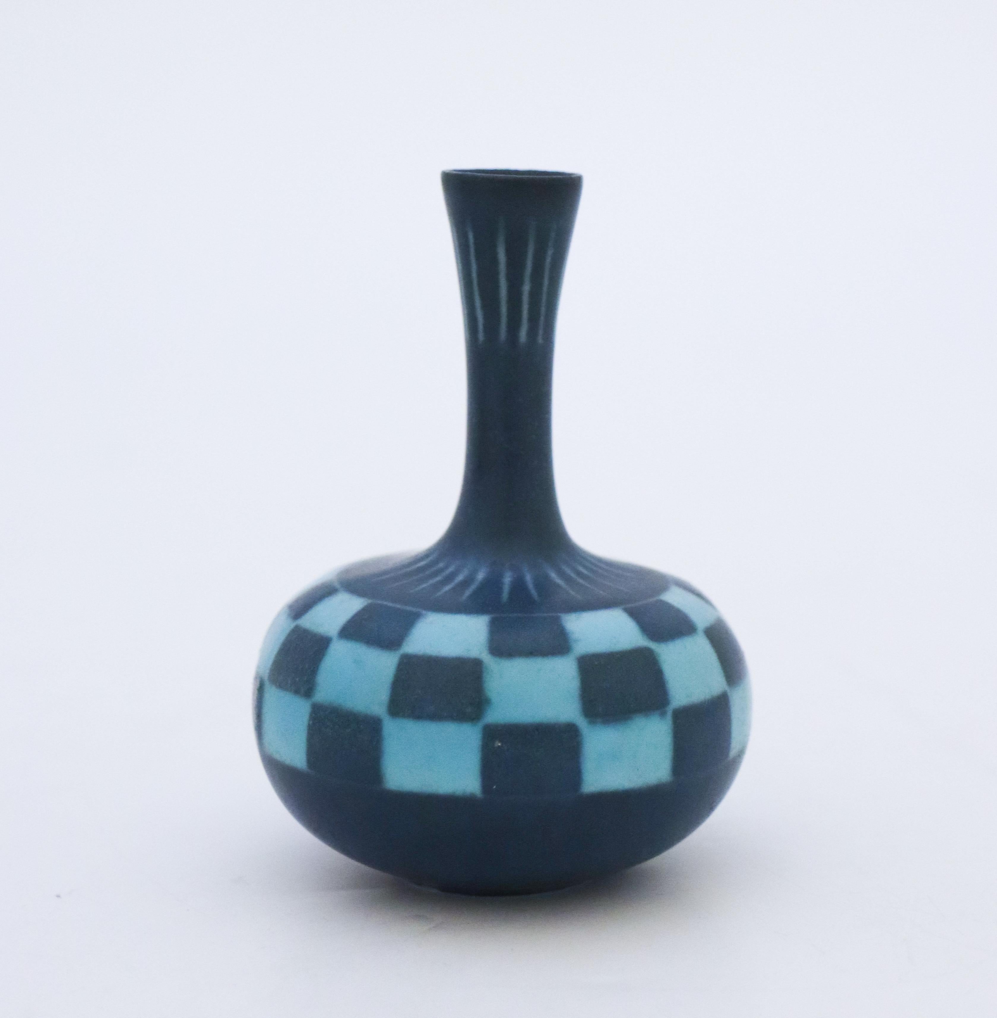 A blue vase with a checked pattern designed by Gunnar Nylund at Rörstrand, they are 8 cm (3.2) high and 5.5 cm (2.2