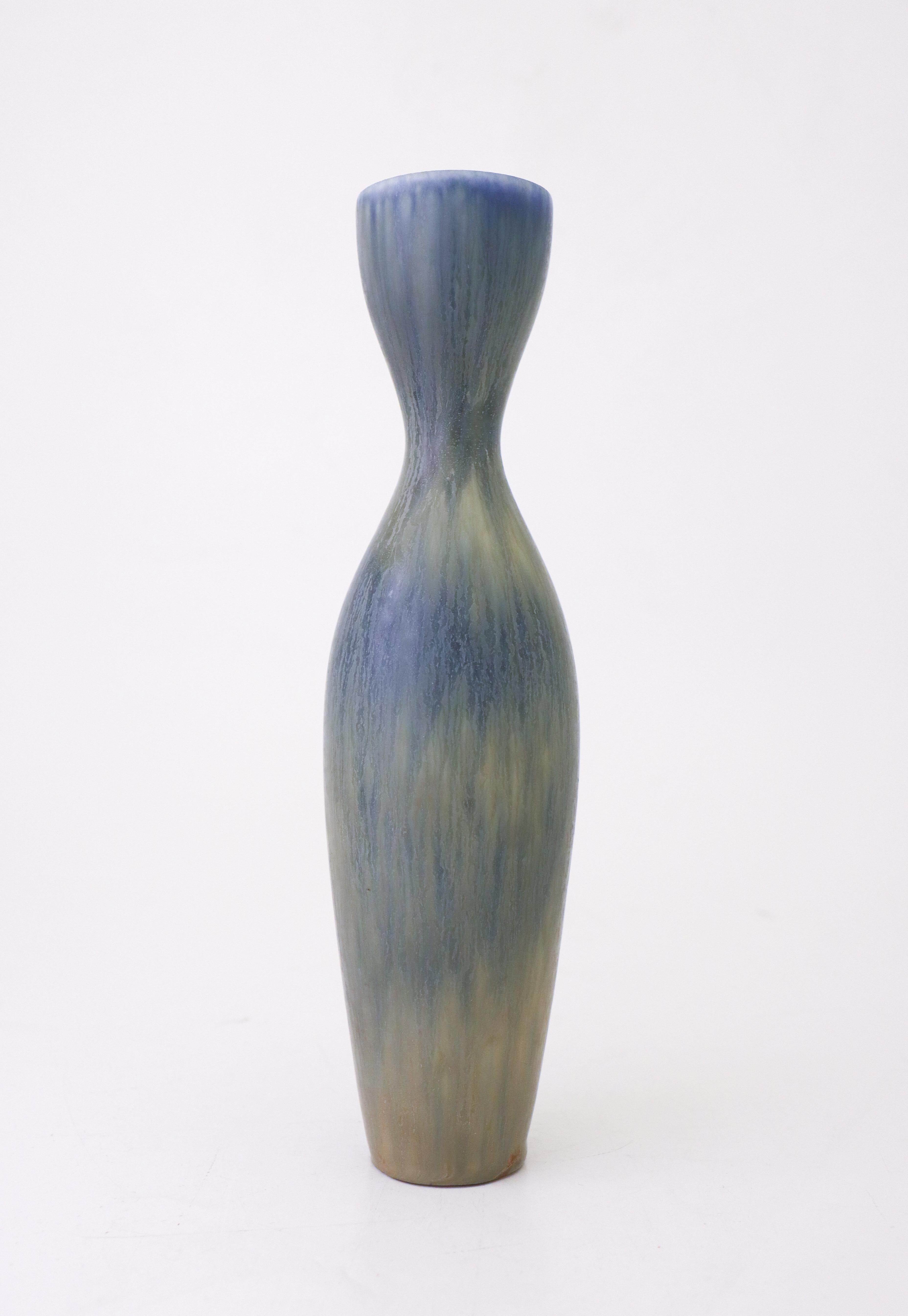 A ceramic vase with a stunning blue glaze designed by Carl-Harry Stålhane at Rörstrand. The vase is 28 cm (11.2