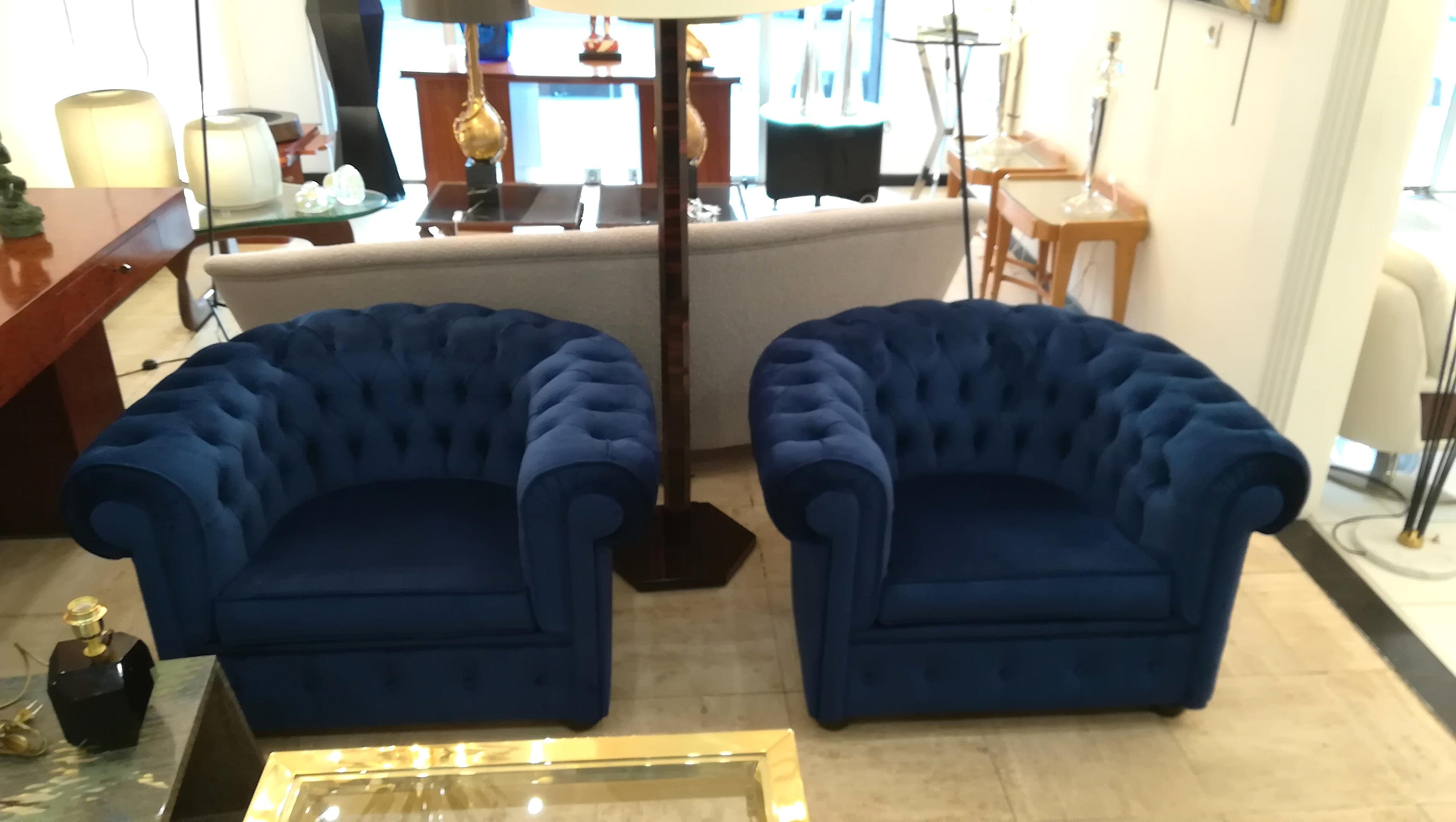 Blue velvet armchairs, Chesterfield form.