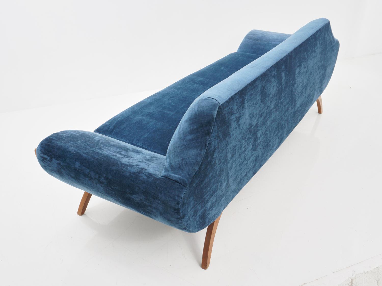 You won't need to ride down the canals of Venice to feel like a queen on this blue gondola. It's the throne you've been waiting for.

A gondola sofa is a type of curved sofa with a distinctive, flowing shape resembling that of a Venetian gondola
