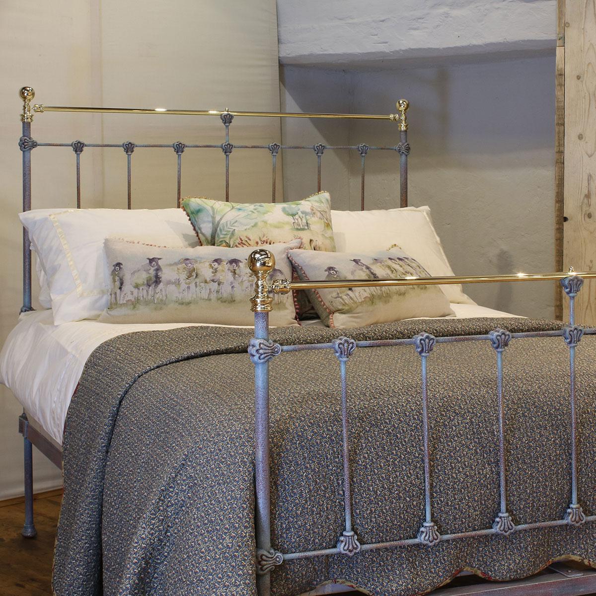 Late Victorian antique brass and iron bed finished in blue verdigris, with straight brass top rail, cast collars and round knobs. 

This bed accepts a double size 4ft 6in wide (54 inch or 135cm) base and mattress.

The price includes a firm