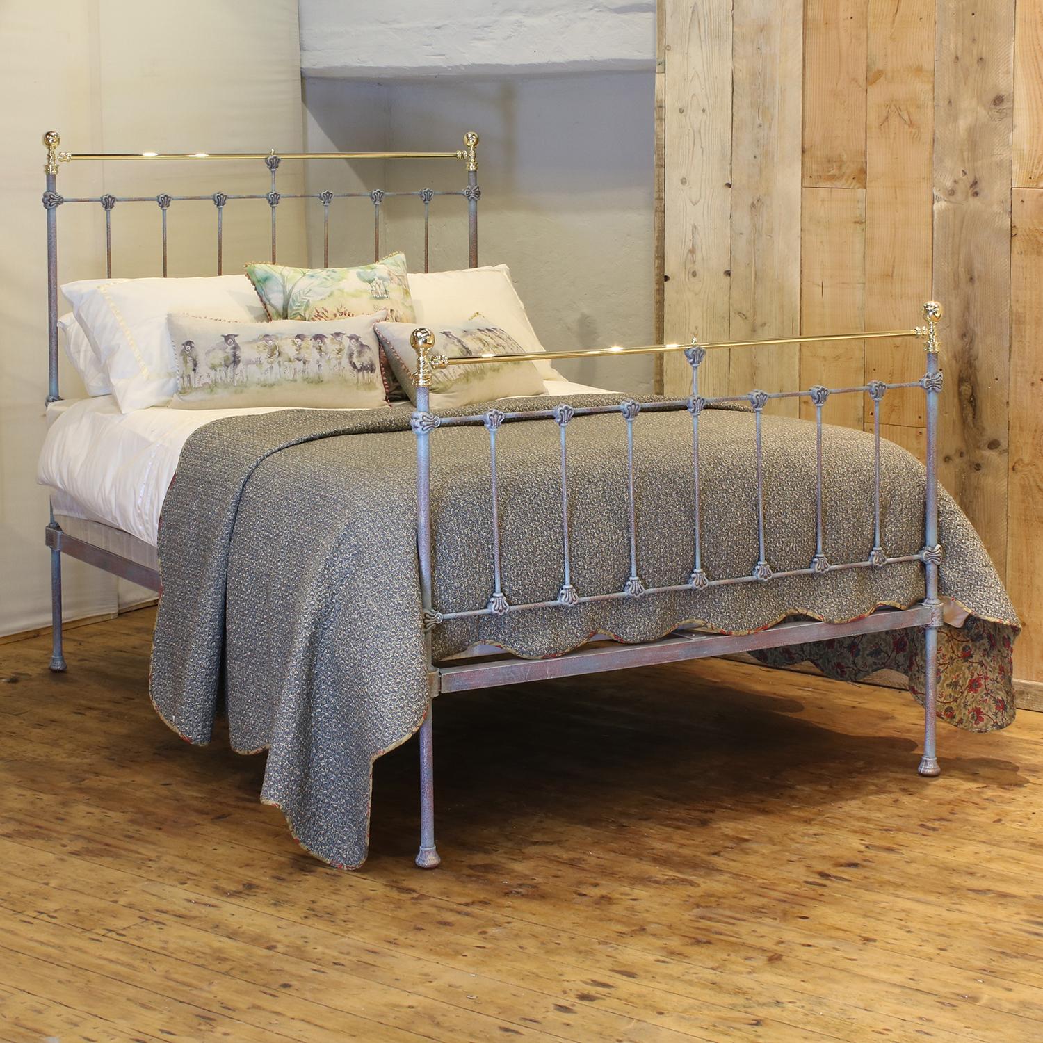 Late Victorian antique brass and iron bed finished in blue verdigris, with straight brass top rail, cast collars and round knobs. 

This bed accepts a double size 4ft 6in wide (54 inch or 135cm) base and mattress.

The price includes a firm solid