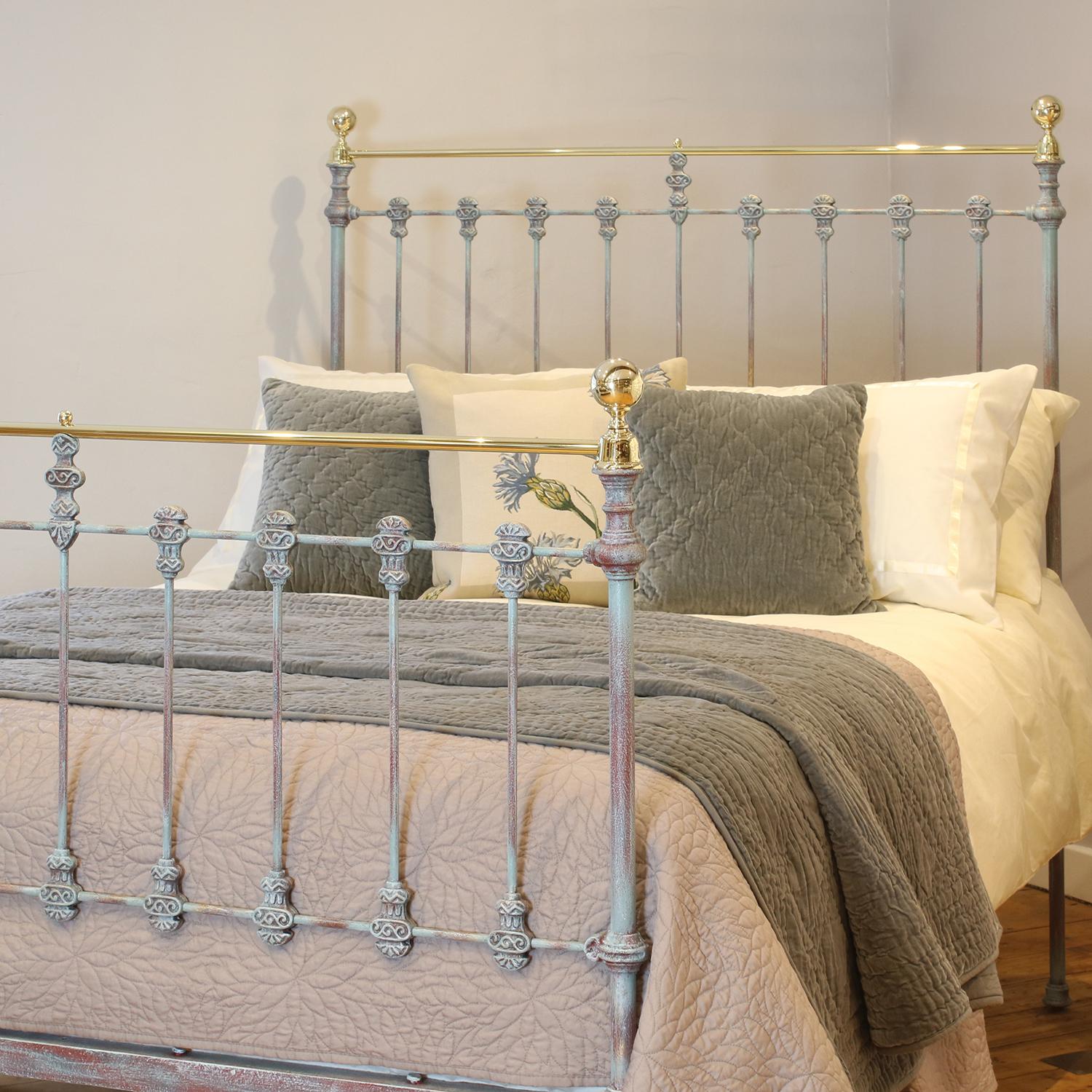 Late Victorian antique brass and iron bed with decorative cast iron mouldings, finished in blue verdigris, with straight brass top rail and round knobs. 

This bed accepts a double size 4ft 6in wide (54 inch or 135cm) base and mattress.

The