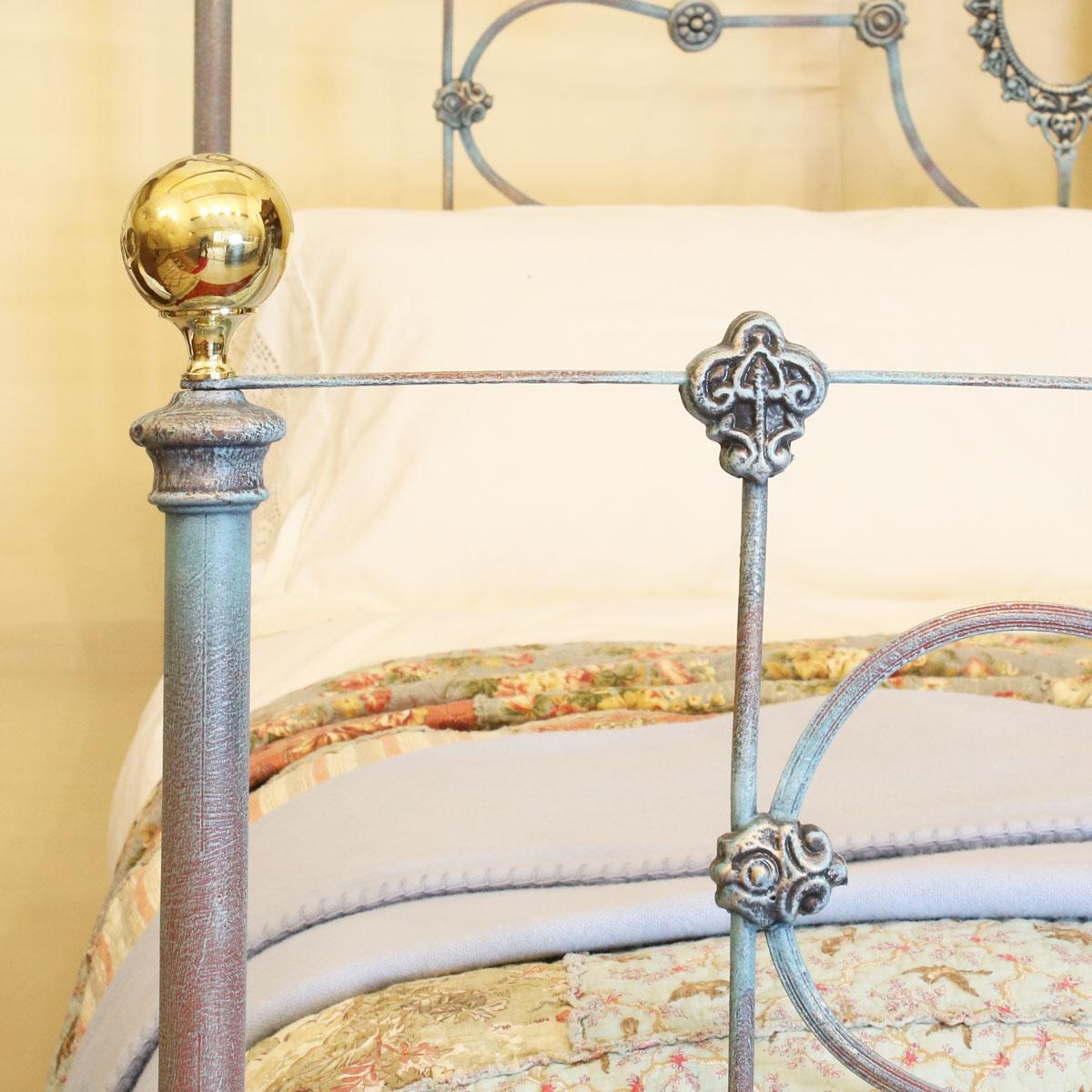 5ft wide attractive cast iron half tester bed finished in blue Verdigris.

The price includes a standard firm bed base to support the mattress. 

The mattress, bedding and bed linen are extra.