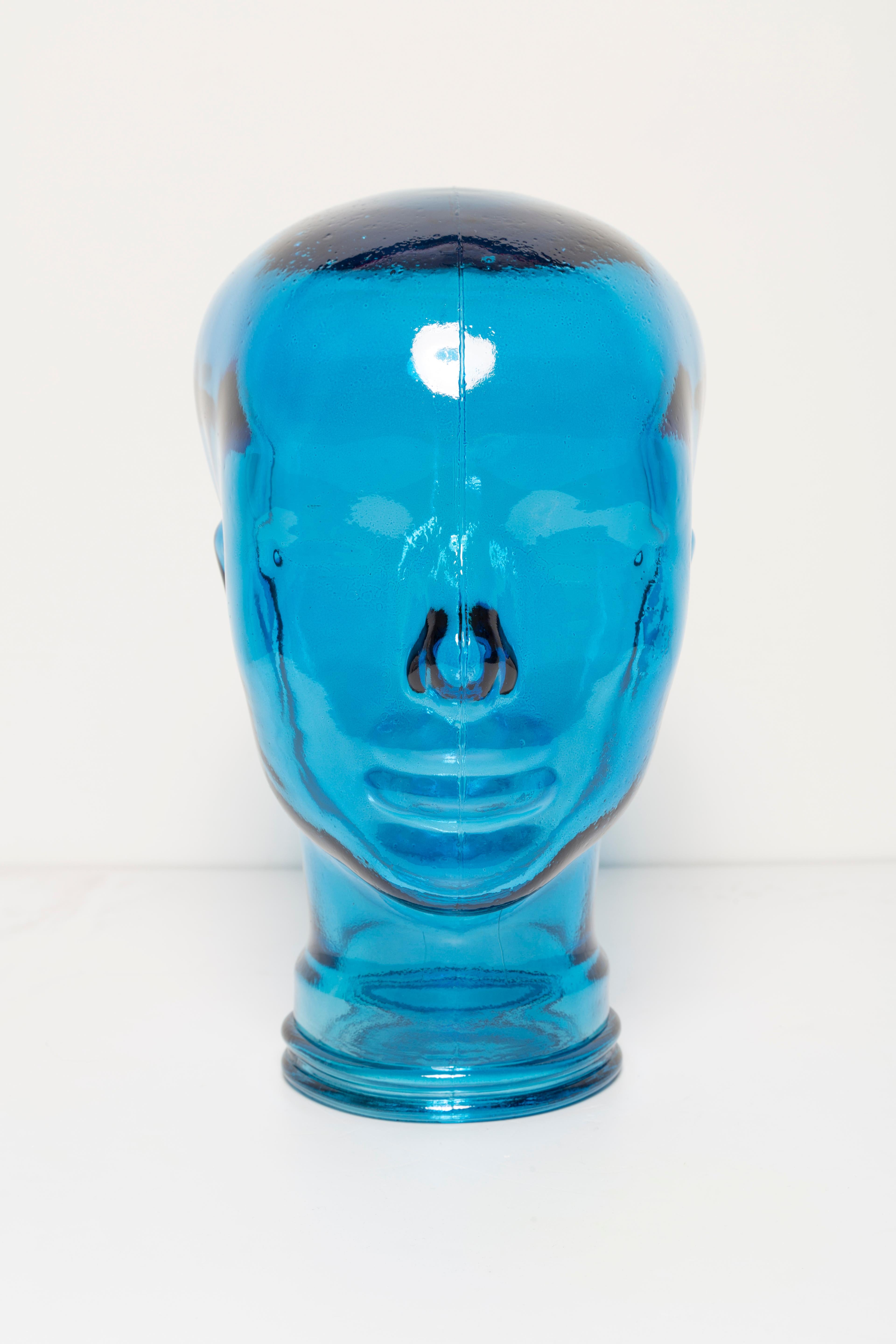 Life-size glass head in a unique blue color. Produced in a German steelworks in the 1970s. Perfect condition. A perfect addition to the interior, photo prop, display or headphone stand.