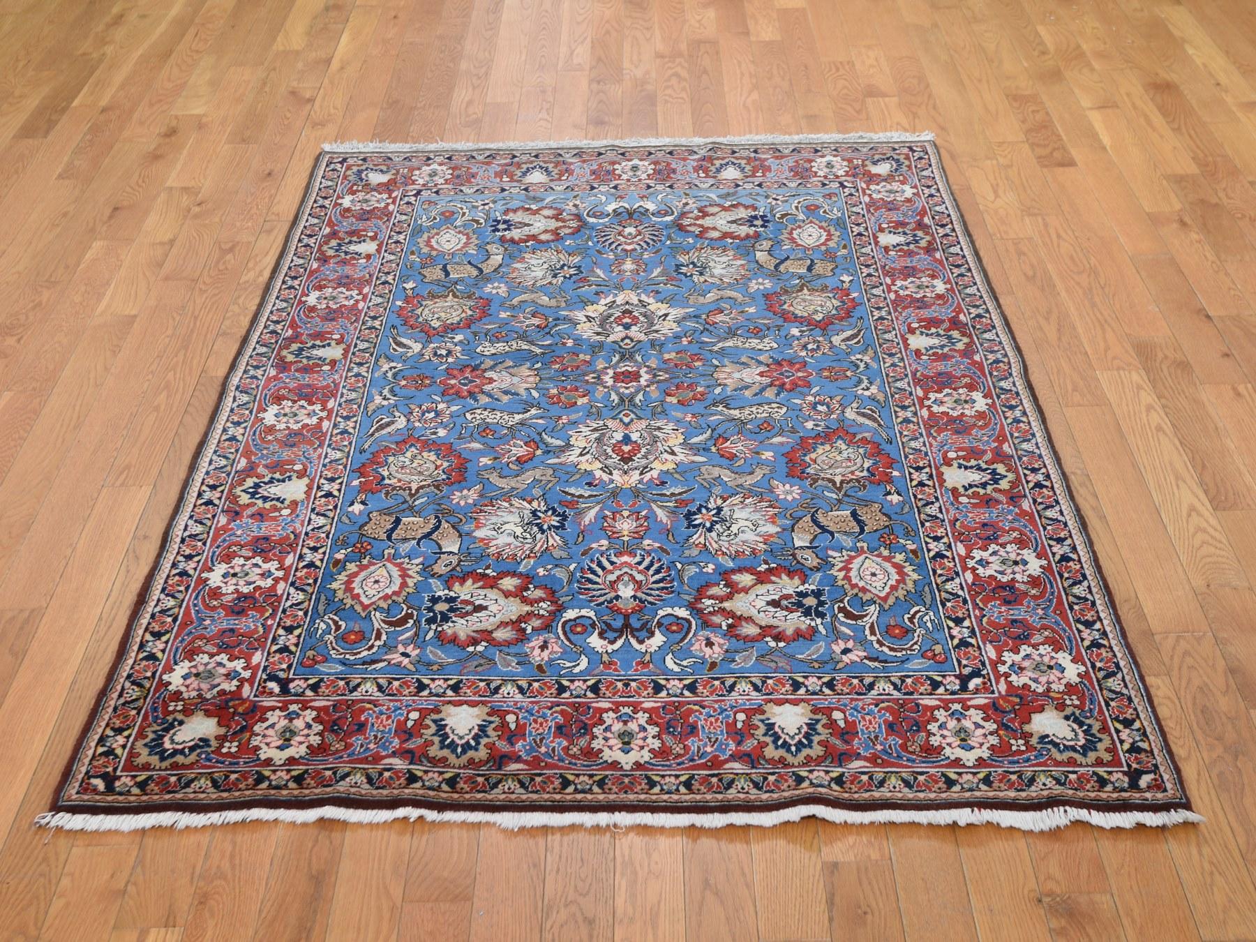 This is a truly genuine one-of-a-kind blue vintage Persian Qum full pile excellent condition hand knotted rug. It has been knotted for months and months in the centuries-old Persian weaving craftsmanship techniques by expert artisans. 

Primary