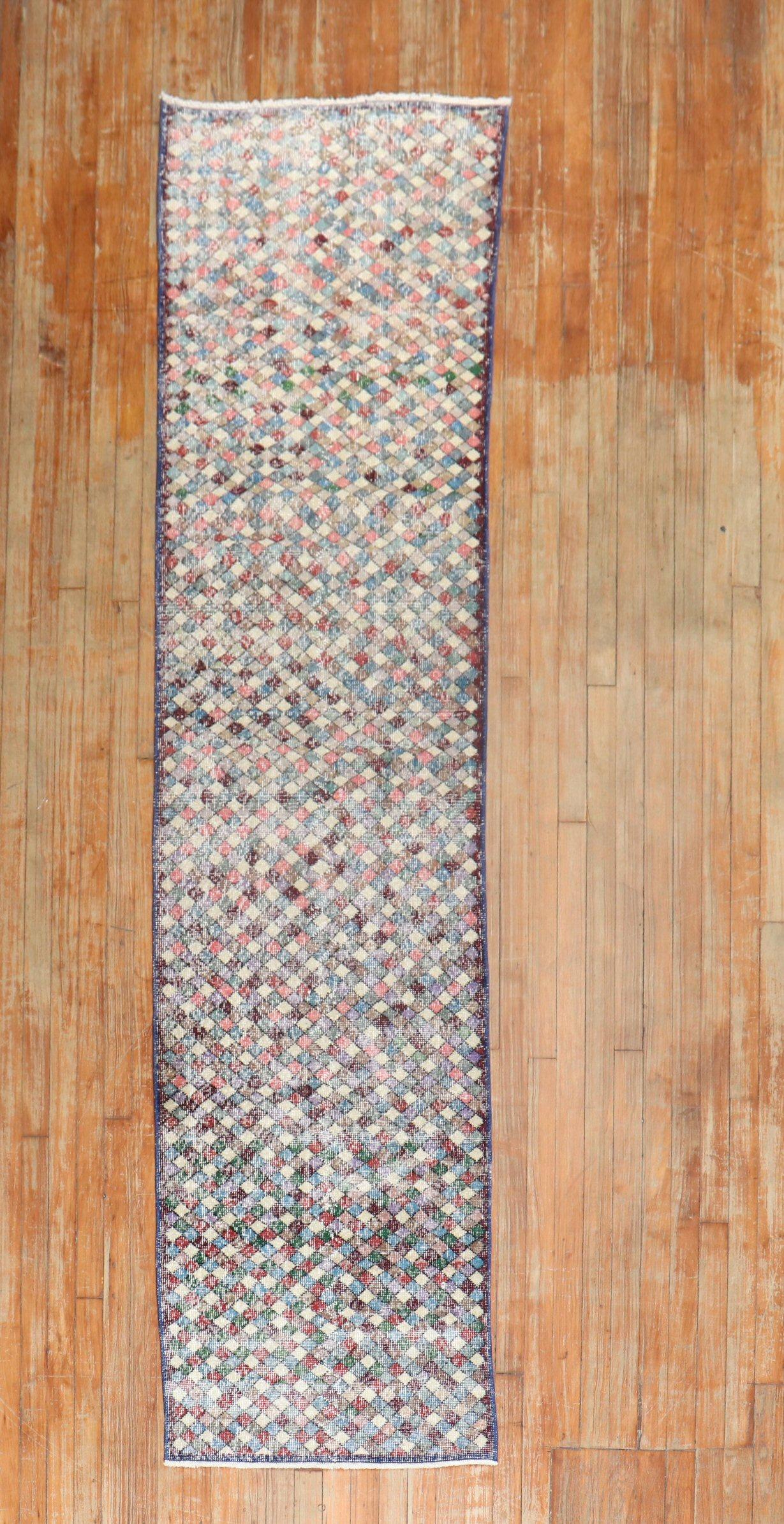 A mid-20th worn century Turkish Deco runner with an all-over repetitive diamond motif throughout.

Measures: 2'3'' x 10'5''.