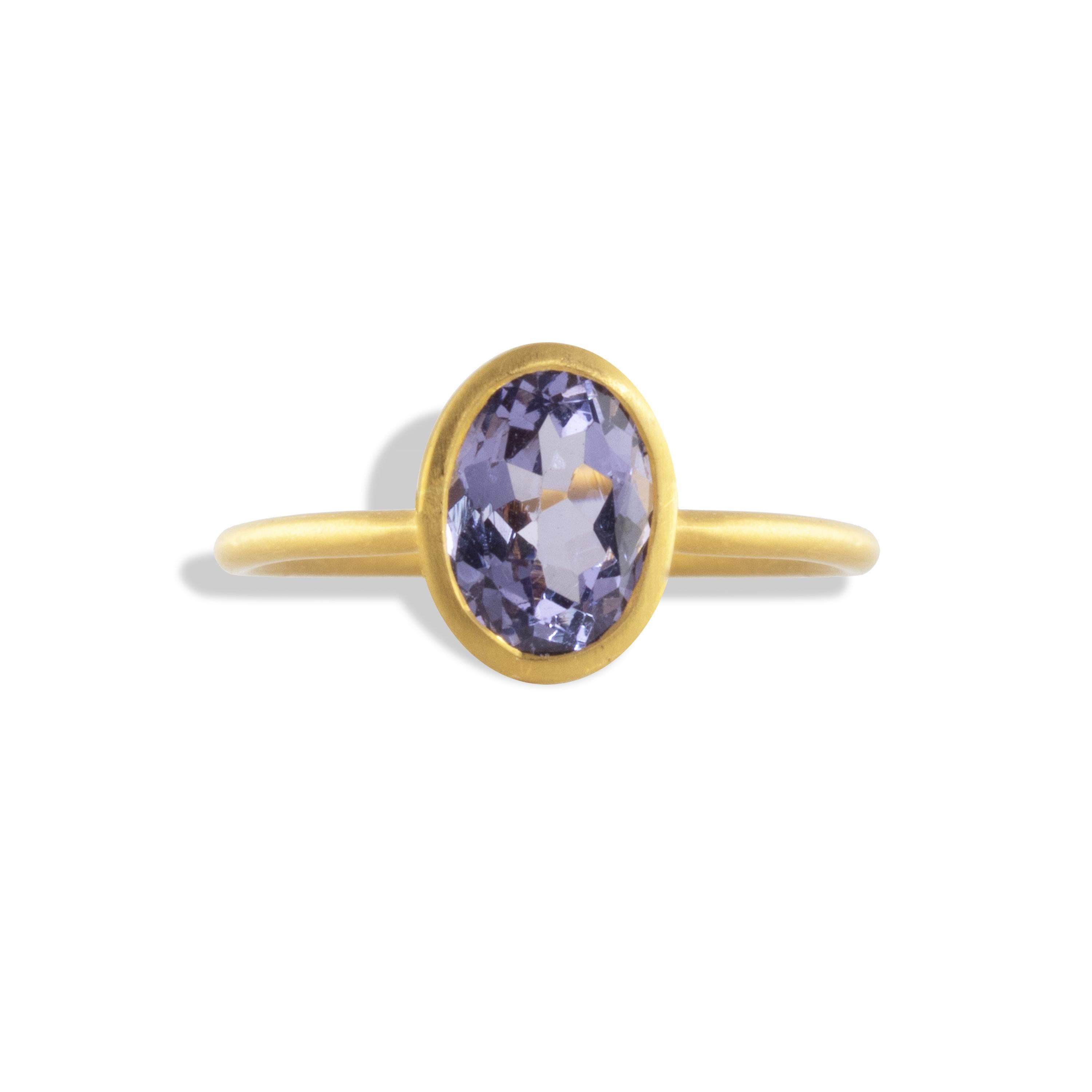 Beautiful blue-violet Spinel stacking ring in 22k matte yellow gold.  1.34 carats of this unique color of Spinel looks great alone of stacked with other rings.

Spinel is believed to encourage great passion, devotion and longevity.  Spinel is a