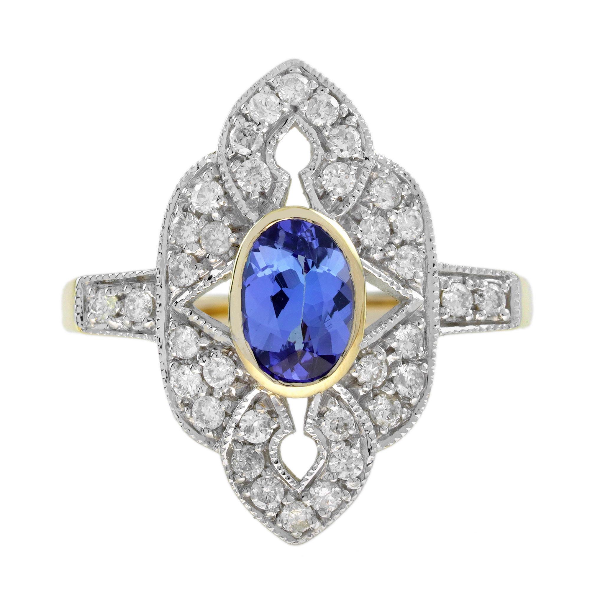 A two-tone gold vintage inspired Tanzanite and Diamond Engagement Ring. This gorgeous antique style elongated ring features charming blue tanzanite at approx. 1.10 carat and diamonds accent. This ring features milgrain edges on the metal. A jewelry