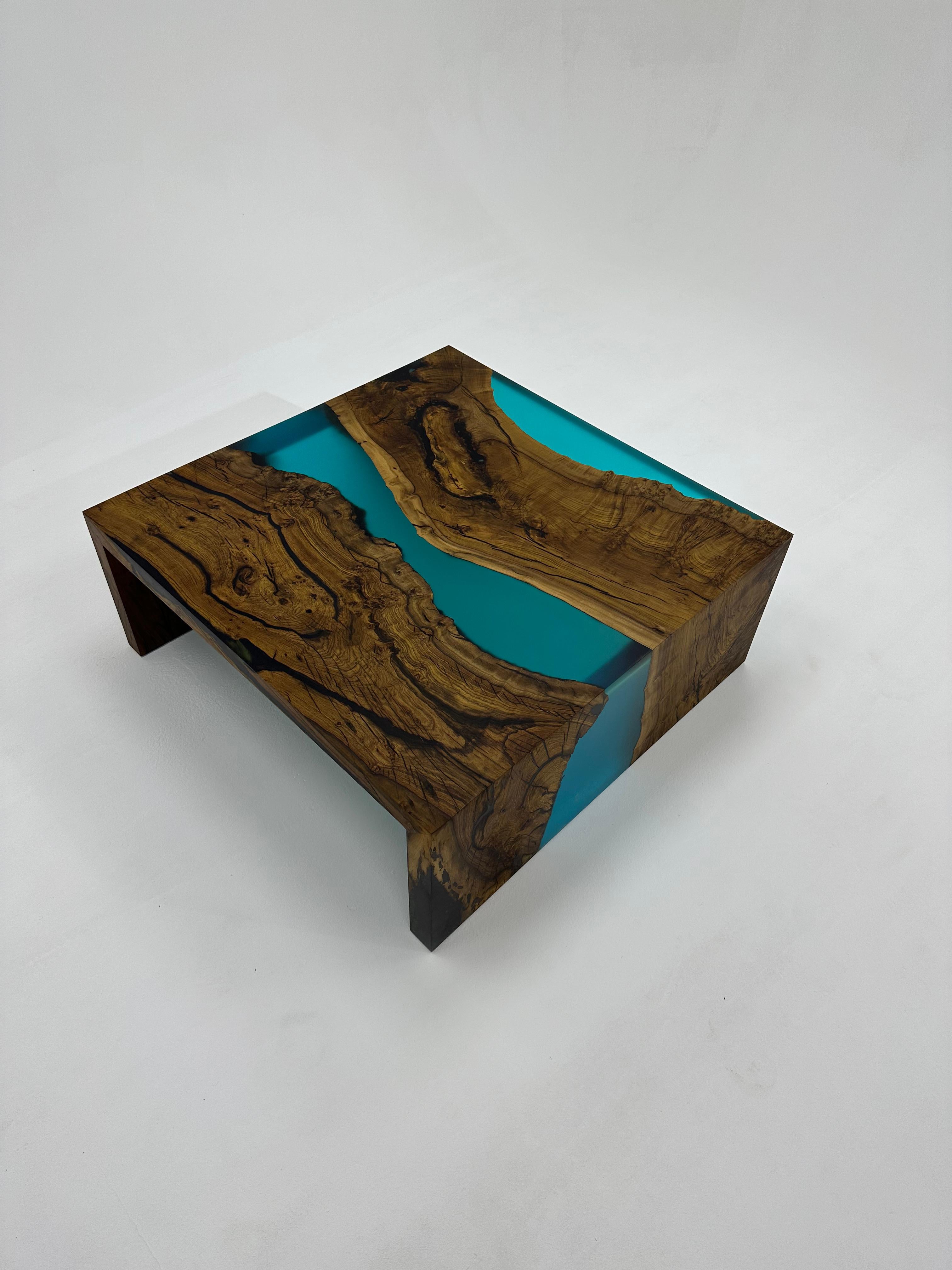 Waterfall Walnut Epoxy Coffee Table

Presenting our Epoxy Waterfall Coffee Table – a true sample of craftsmanship and elegance. This exceptional piece of furniture is designed to be more than just a coffee table; it's a statement of refined taste