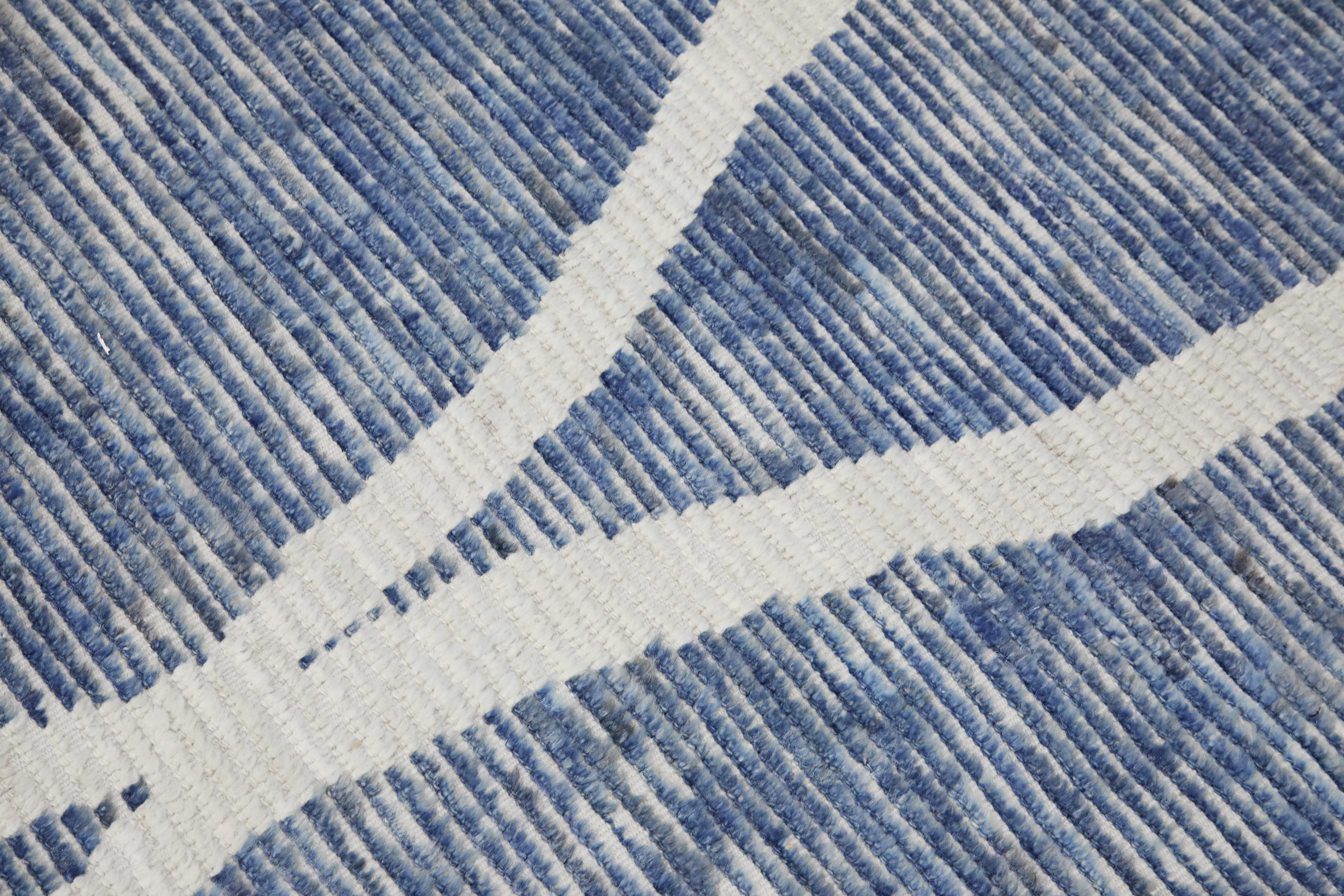 Introducing our exquisite handwoven wool modern Moroccan-style rug, a stunning blend of traditional craftsmanship and contemporary design. Measuring 9'9
