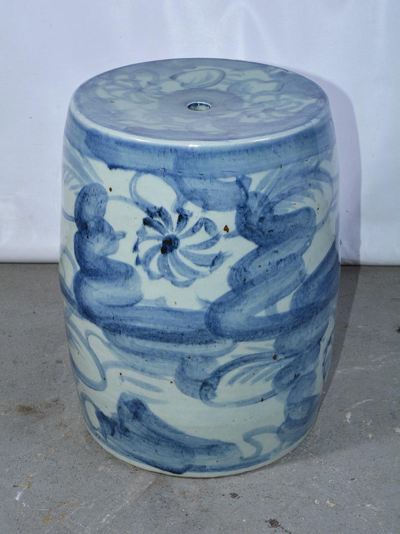 Chinese blue and white porcelain drum shape garden stool in floral motif. The ceramic stool can be used as plant Stand, side table or extra seating. Wonderful in a garden room, porch, or the most elegant living room.