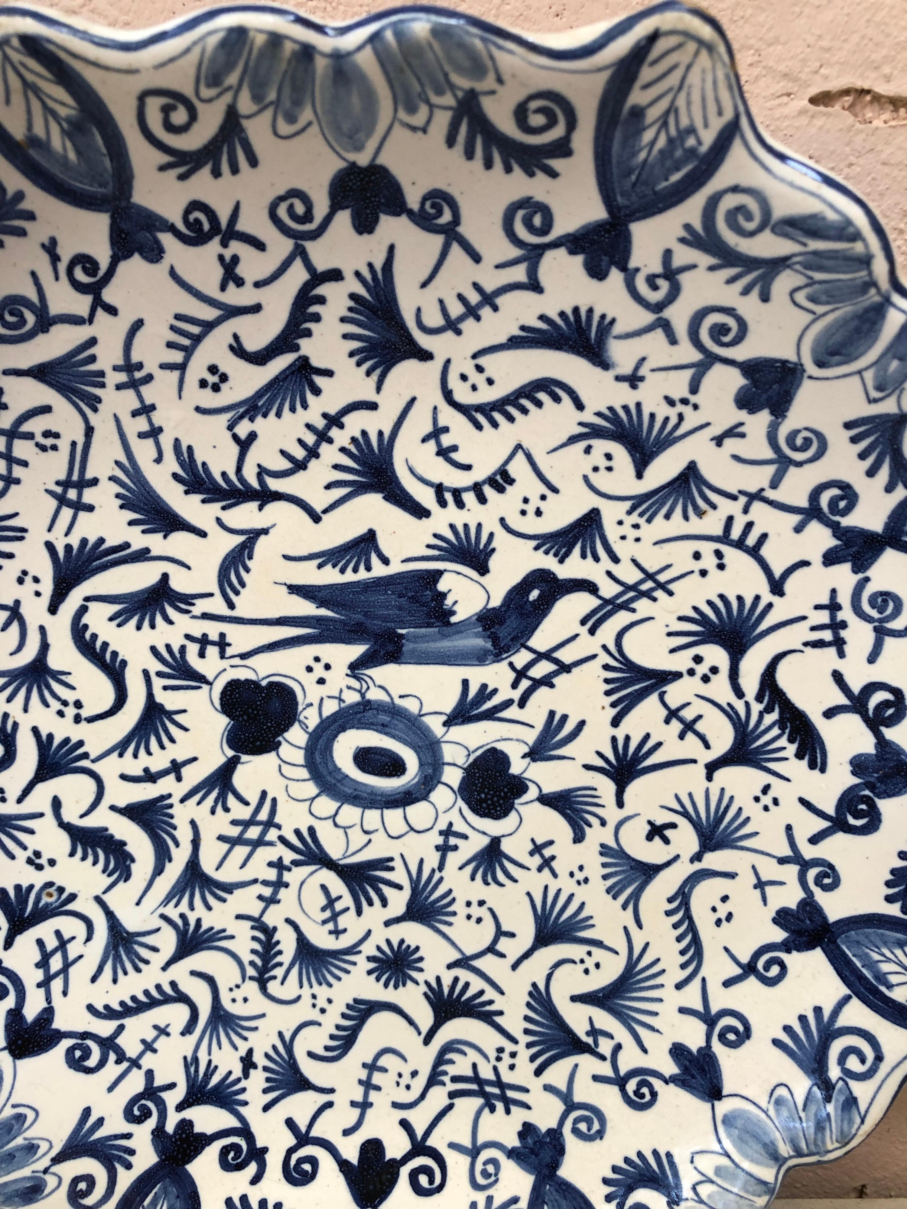 Blue & White Faience handled platter Circa 1920.
Geometrical pattern and bird on the center.