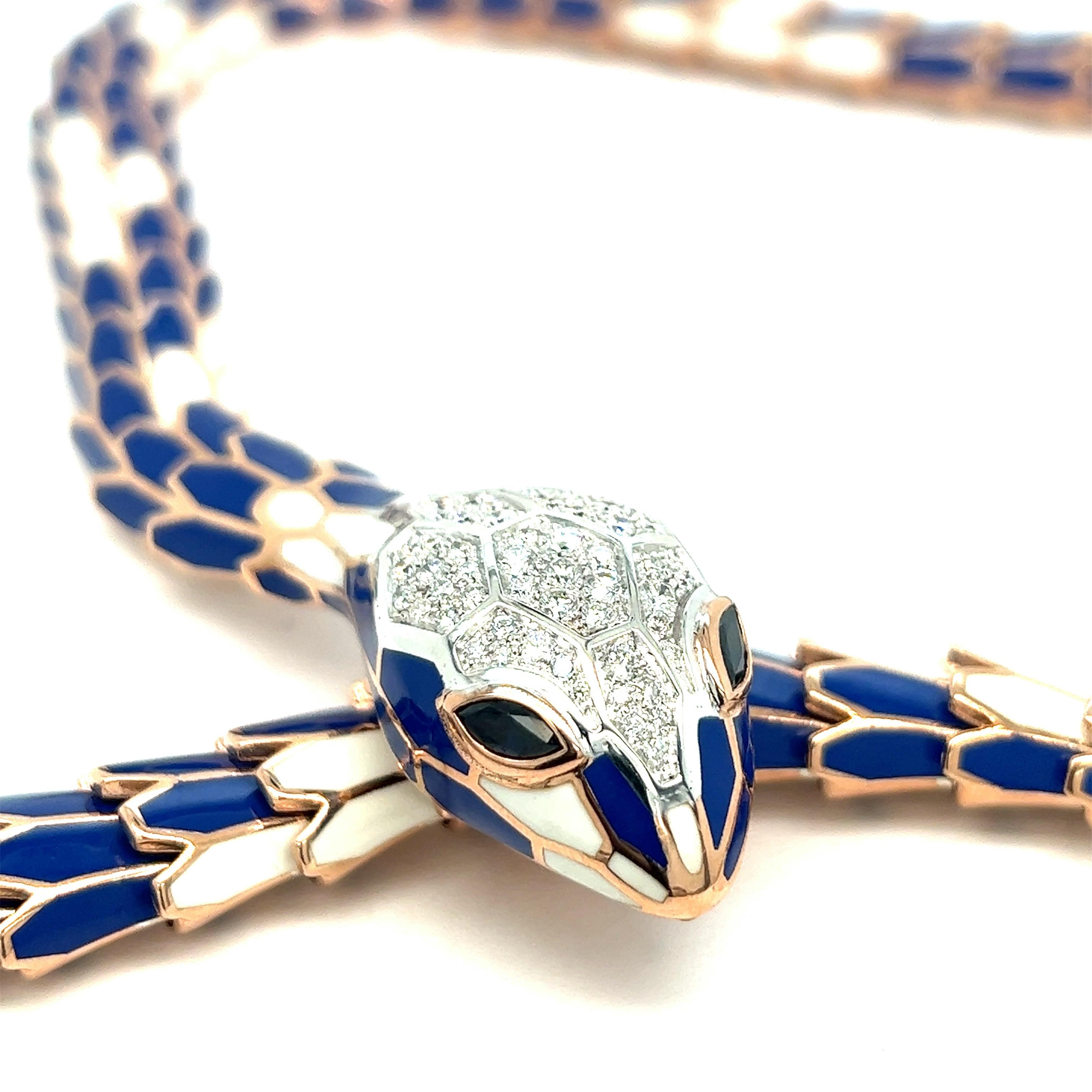 Blue and white enamel diamond sapphire snake necklace

Round-cut diamonds of 1.20 carats, Marquise-shaped sapphires of 0.56 carat, 18 karat white gold, and silver with a tone of rose gold; marked 750, 925, D. 1.20, S. 0.56, N004RM20M01-0111

Size: