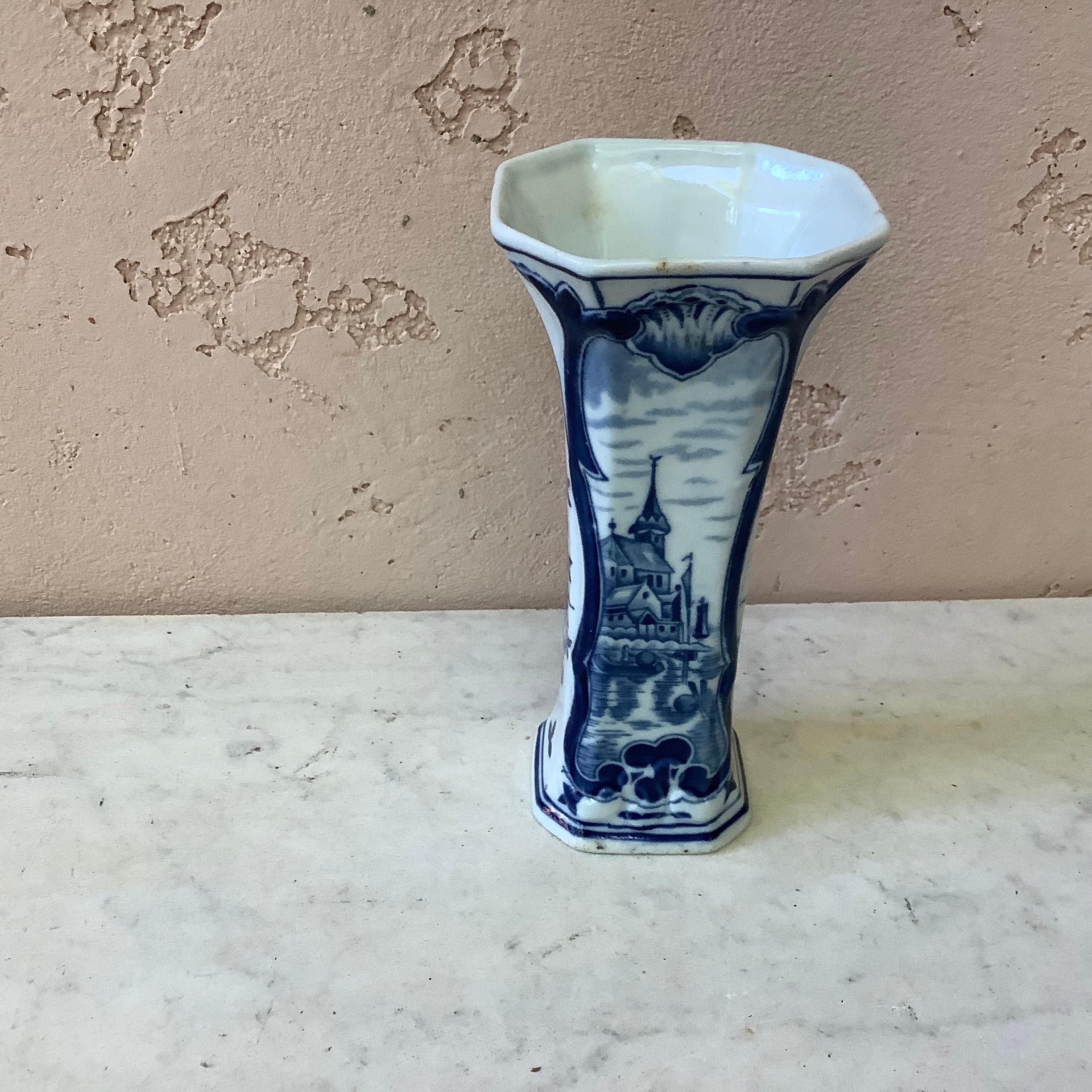 Dutch blue and white faience vase with Classic motifs and floral details marked 