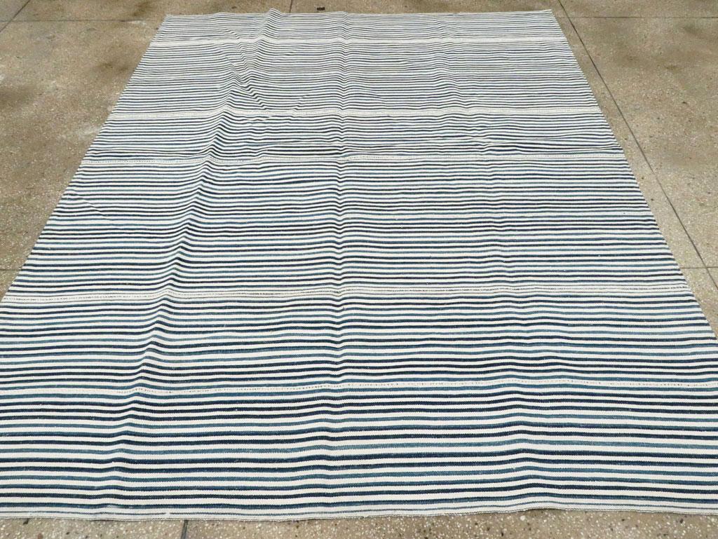 A vintage Persian flatweave Kilim accent rug in square format handmade during the mid-20th century in shades of blue and white.

Measures: 6' 8