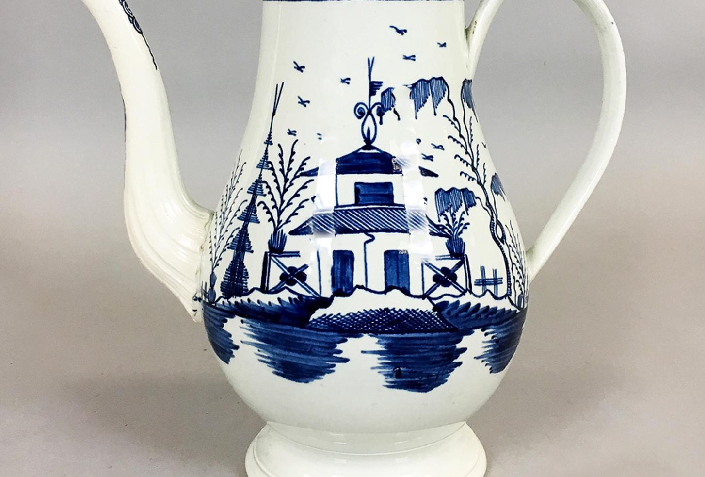 Blue and white pearlware 18th century coffeepot, 
Circa 1785

The Staffordshire chinoiserie pearlware coffeepot is painted in underglaze blue with a chinoiserie scene of a Chinese building is a landscape.

Height: 11 3/4 inches.

Provenance: The