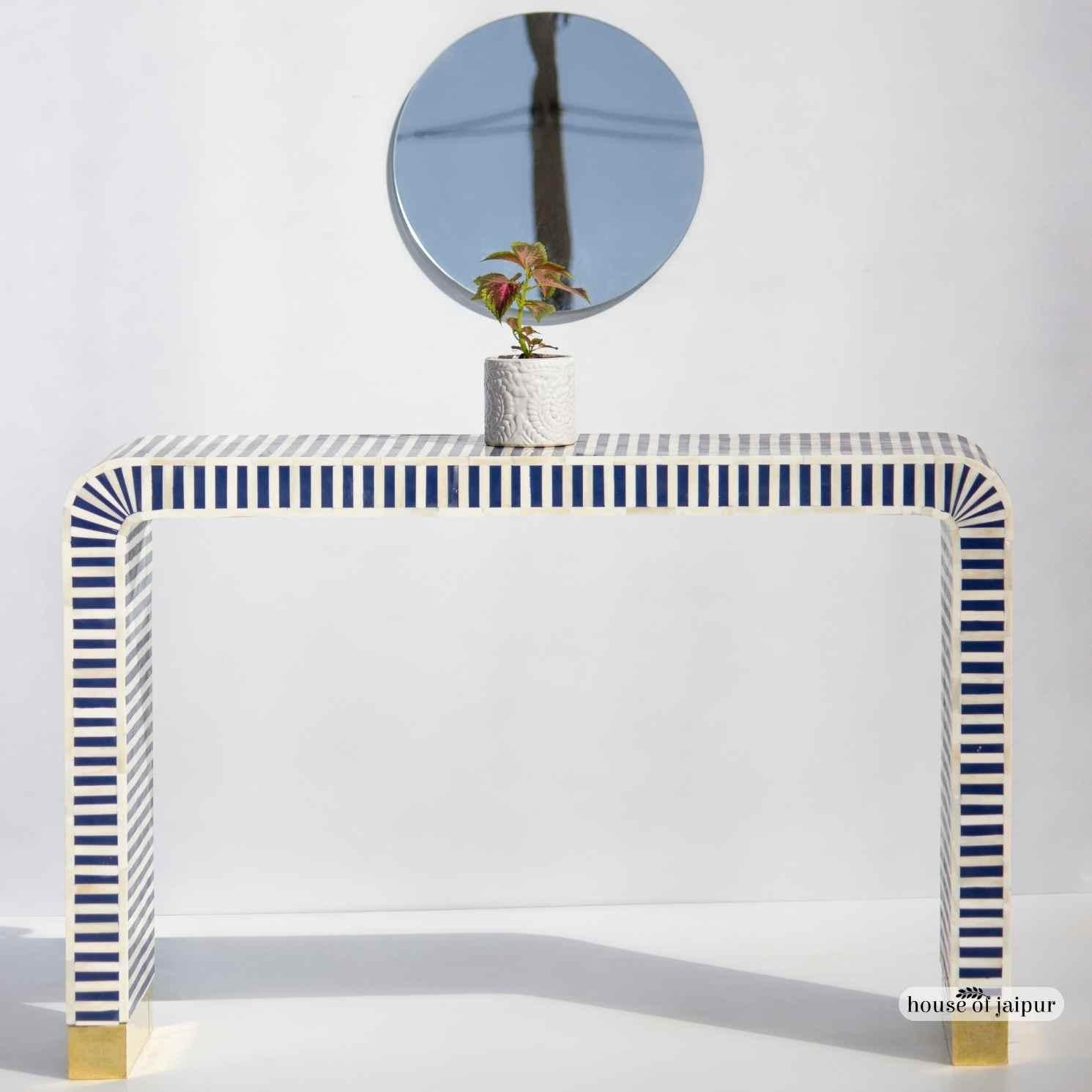 Our Bone Inlay Console Table is a striking and modern addition to any entryway, hallway or living space. Designed in a timeless blue-and-white palette, the console features a clean linear stripe pattern handcrafted using individually cut bone