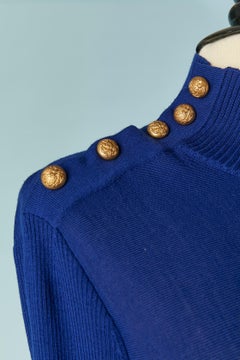 Blue wool knit dress with gold metal button on both shoulder ALEXANDER McQUEEN