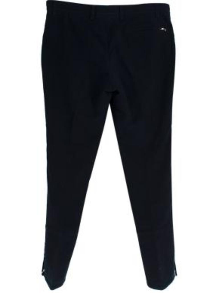 Hermes Blue Wool Tailored Trousers
 
 - Structured boiled wool trousers with hidden silver tone zippered pockets on either sides and one at the back
 - Zips from the hem upwards 
 - Silk lined 
 
 Materials 
 Wool 
 Silk 
 
 Made in Italy 
 Dry