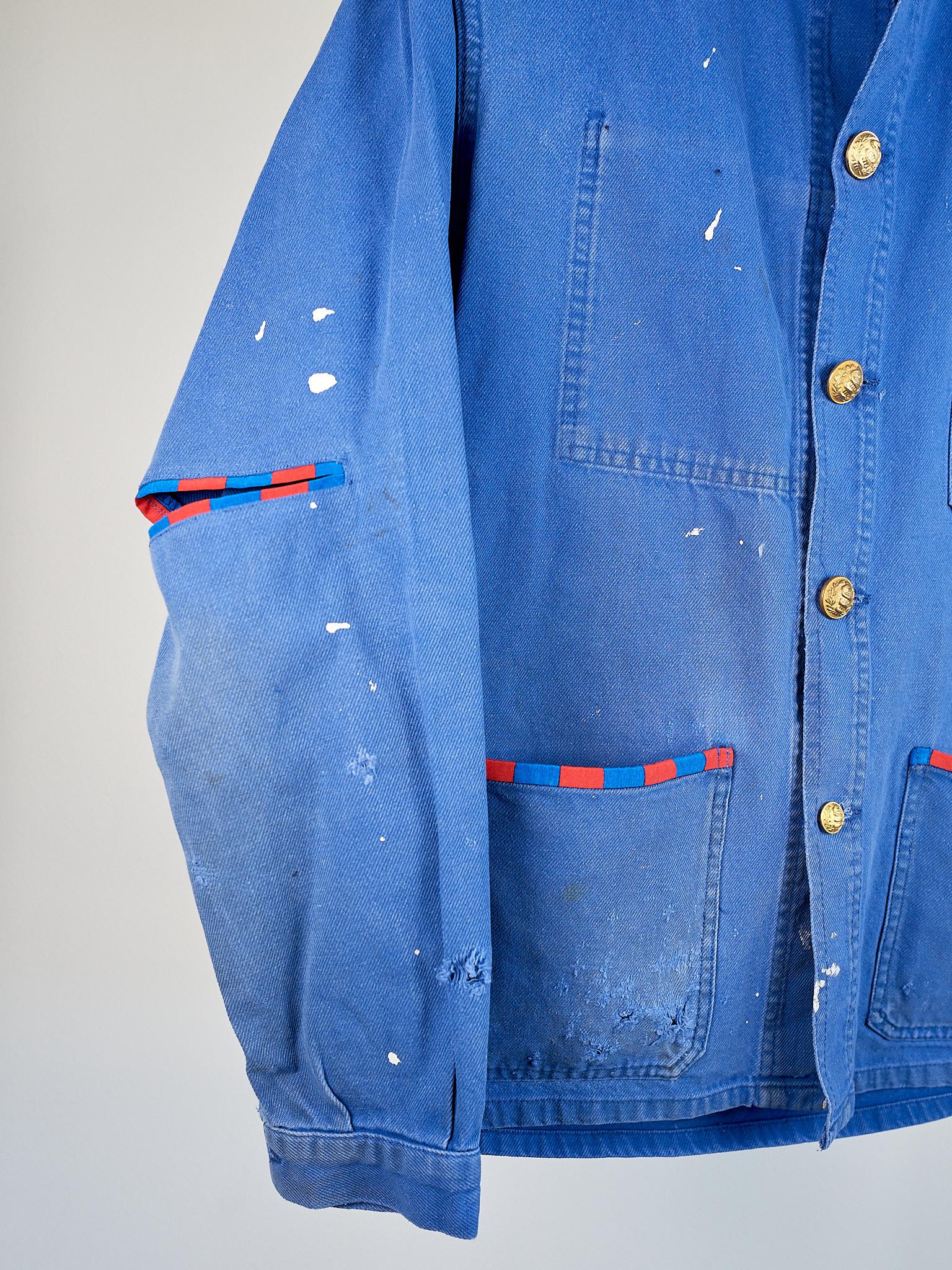 French Work Wear Jacket Distressed Cobalt Blue with some Original Paint Stains, Silver Bullion Fringes, Red Blue Square Silk Reinforcement pockets and open Elbows White Silk Collar

Brand: J Dauphin
Size: Medium 
100% Sustainable Luxury, Up-cycled